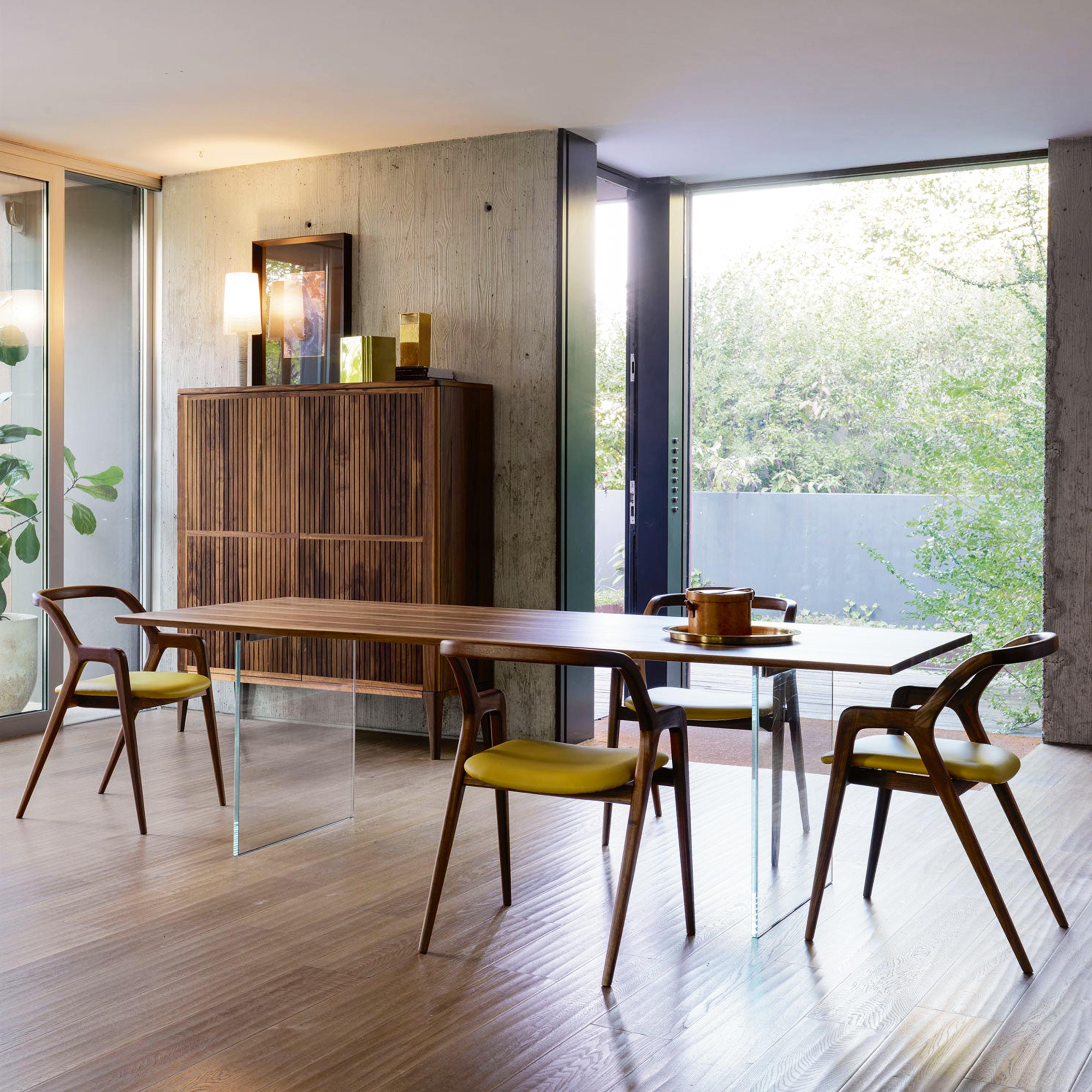 In Breve Chair by Dale Italia
Dimensions: D 56 x W 56 x H 79 cm. SH: 46 cm.
Materials: Walnut and fabric/leather. 

Chair in solid Canaletto walnut. Available in different upholstery options and grey/natural walnut finishes. Prices may vary. Please