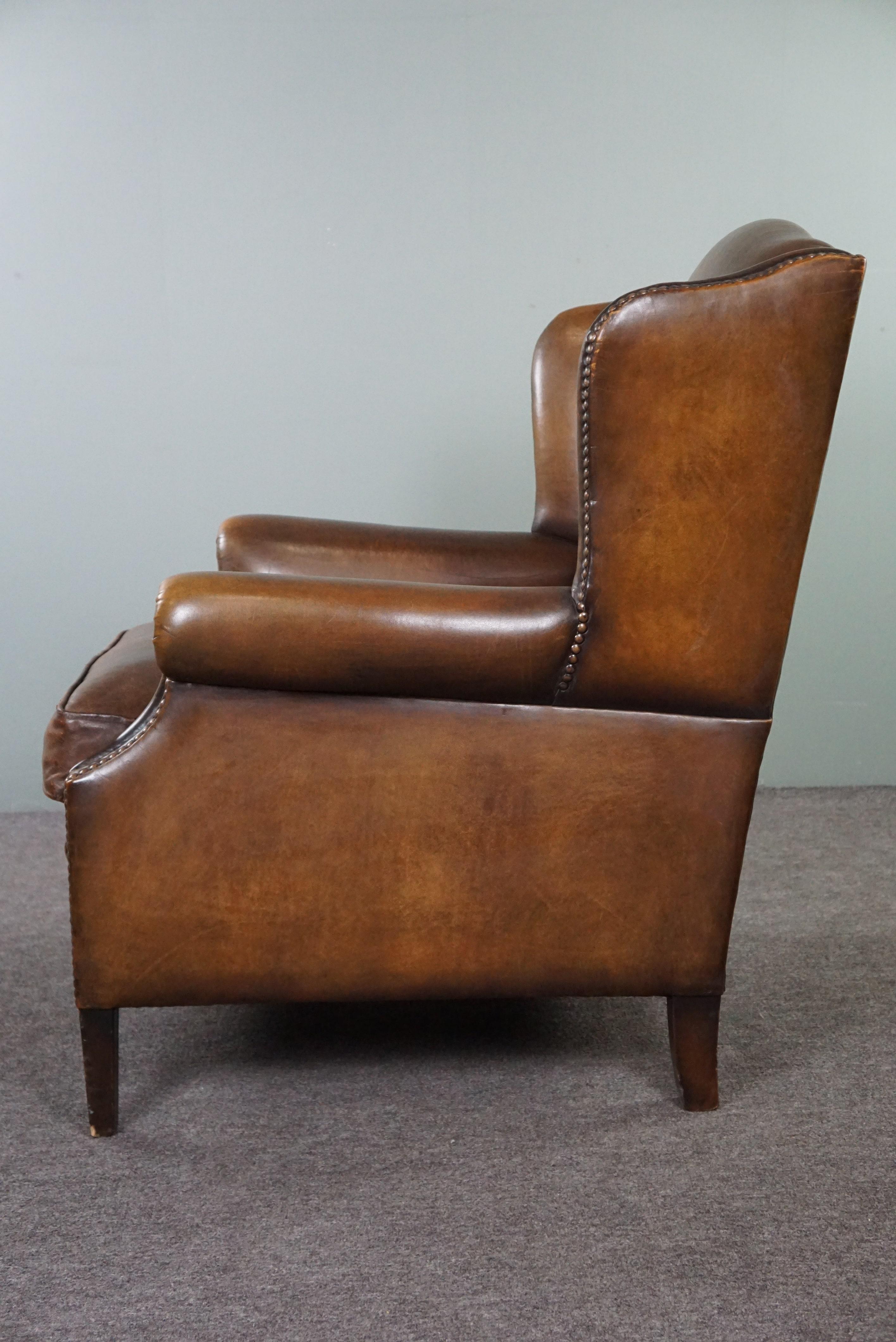 Leather In good condition wingback chair made of sheepskin For Sale