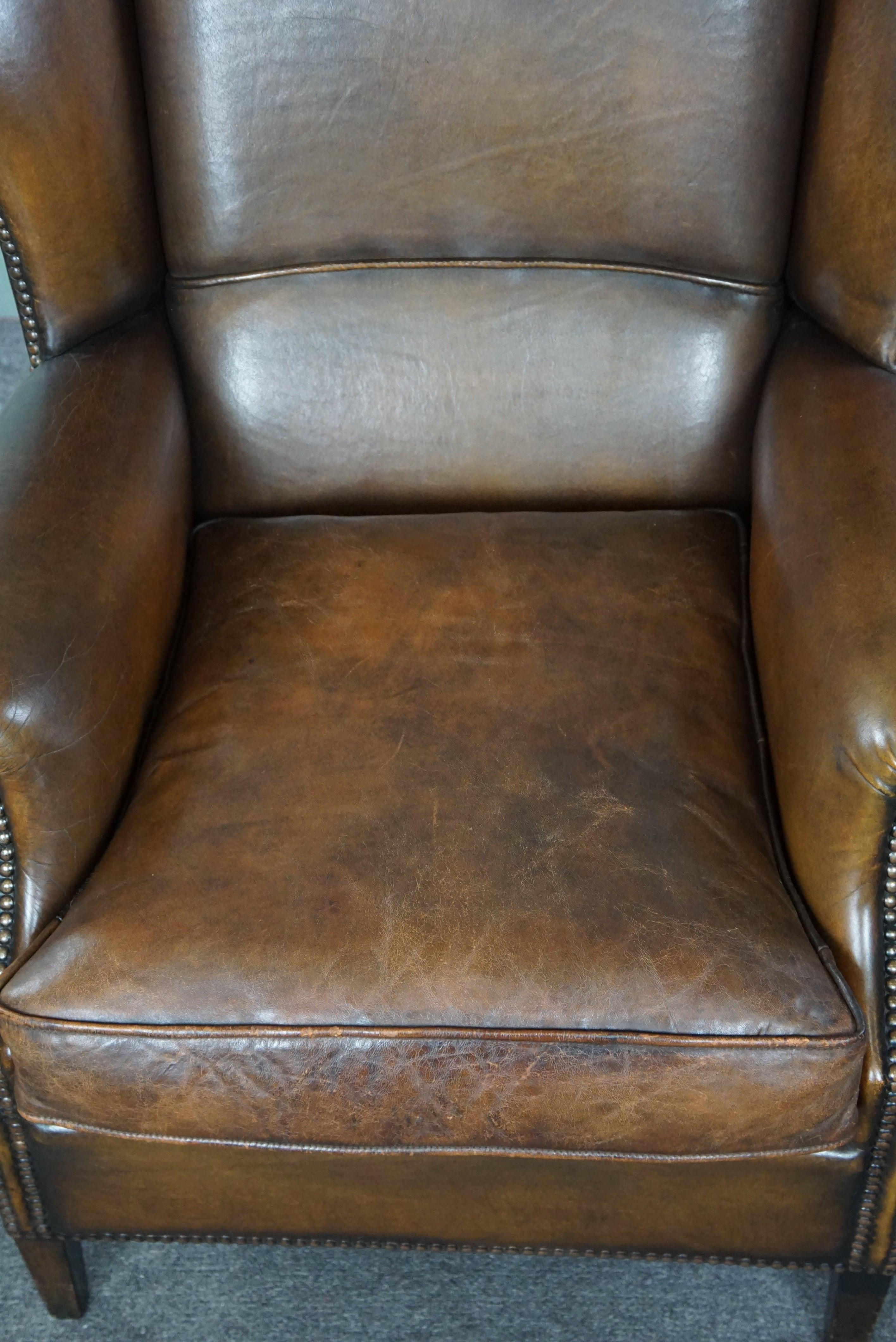 In good condition wingback chair made of sheepskin For Sale 1