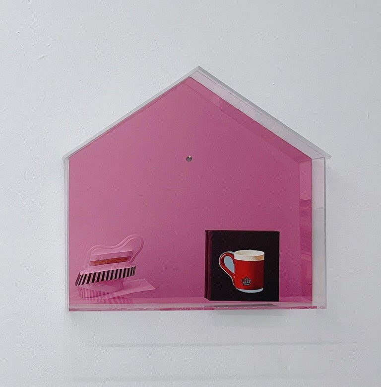 The structure of the artwork is made of plexiglass, shaped like a house. Inside the “house”, there’s a small painting depicting a mug. All hand crafted in Atlanta, GA.
The back panel is mirrored in pink color and it reflects the surrounding.