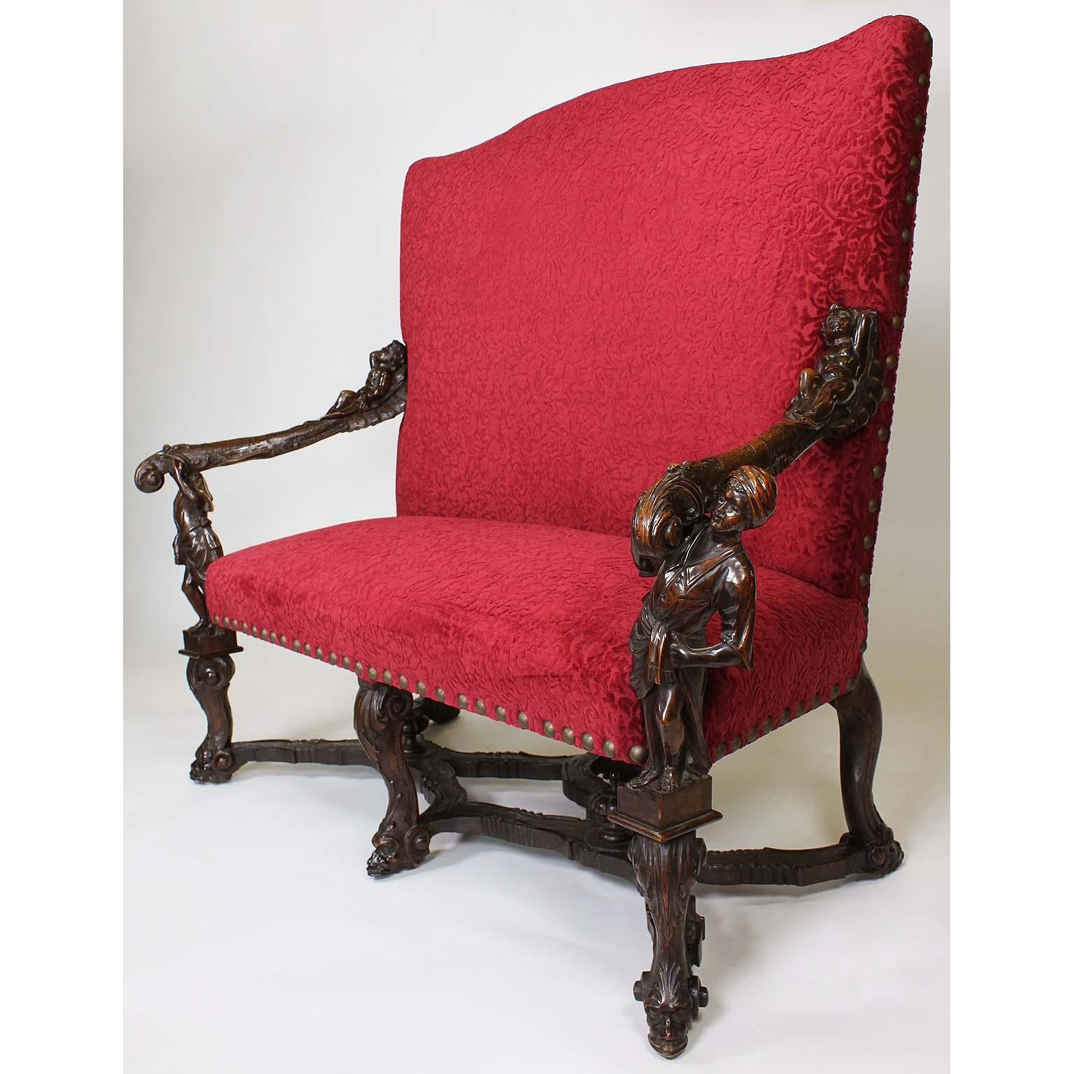 A fine and rare Italian 19th century Baroque style carved walnut figural settee (Sofa-Loveseat), attributed to Valentino Panciera Besarel (Venice, 1829-1902) in the manner of Andrea Brustolon (1662-1732). The ornately carved frame flanked on each