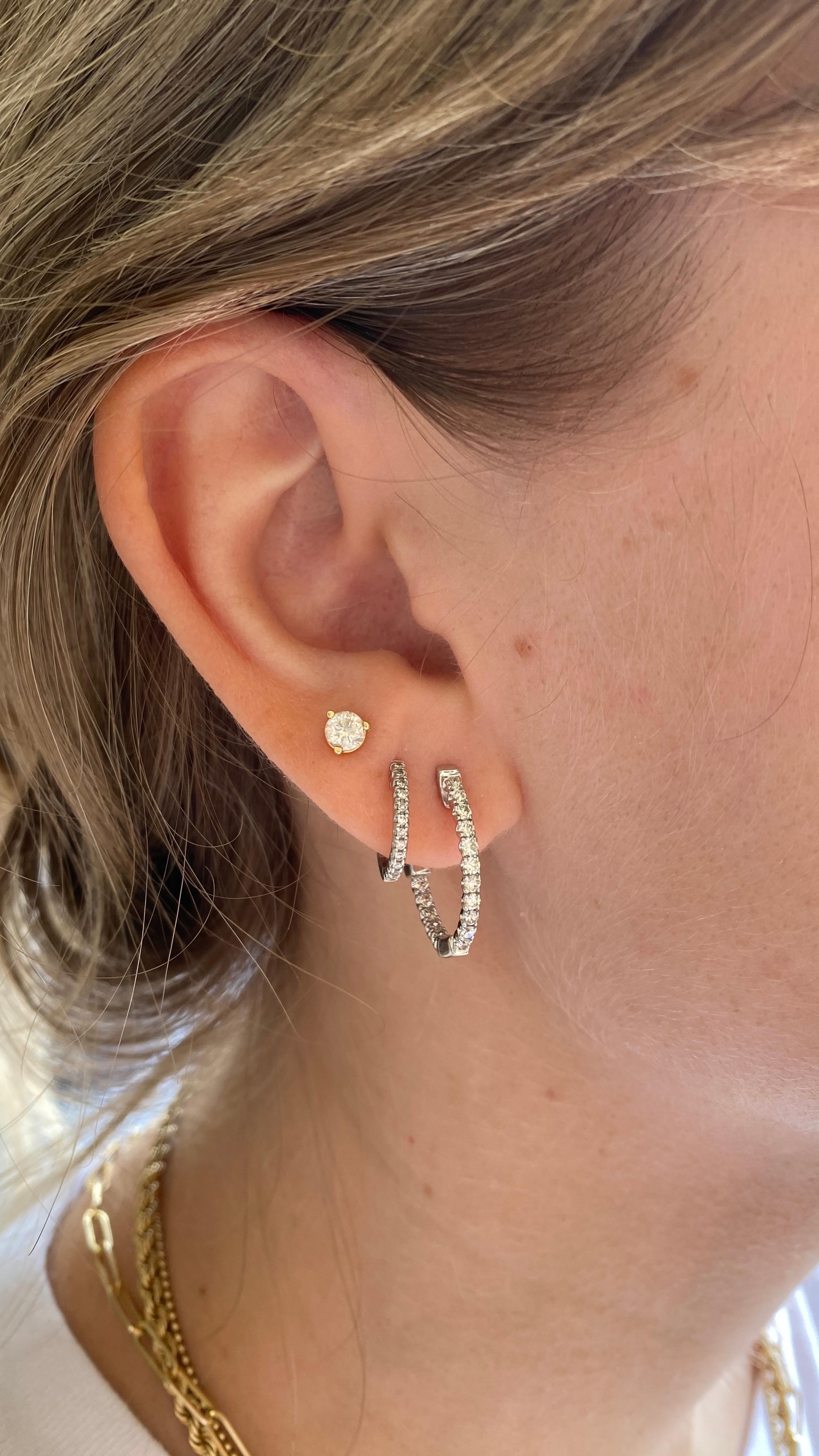 Available in 14k white golf or yellow gold. Your choice!
These bright diamond in & out hoops add a perfect accent to your ear for any look. The diamonds weigh a total of 0.55 carats and the hoops measure 18 mm long by 16 mm wide. These hoops have a