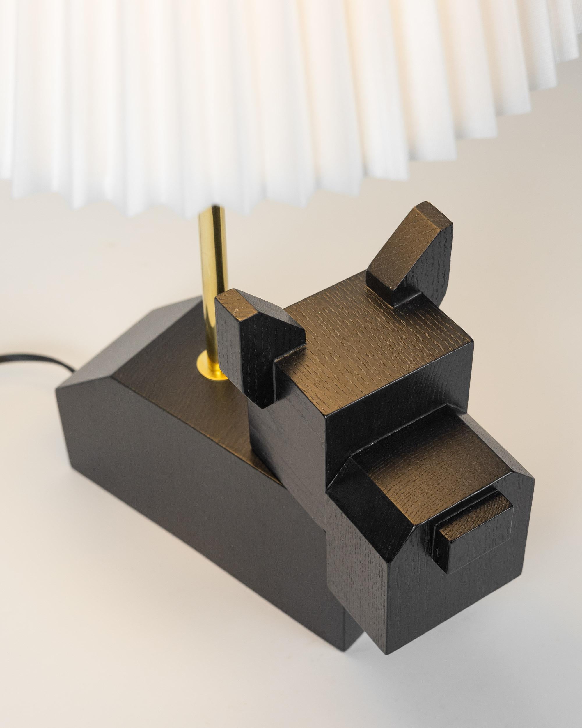 Black Doggy Lamp by Wan Wan Wonderland (Tokyo, Japan)

Delightful and whimsical table lamp with white pleated shades and expertly hand-crafted black wooden base. Each lamp is hand crafted by WAN(of WAN WAN WONDERLAND), an artist and dog lover, at