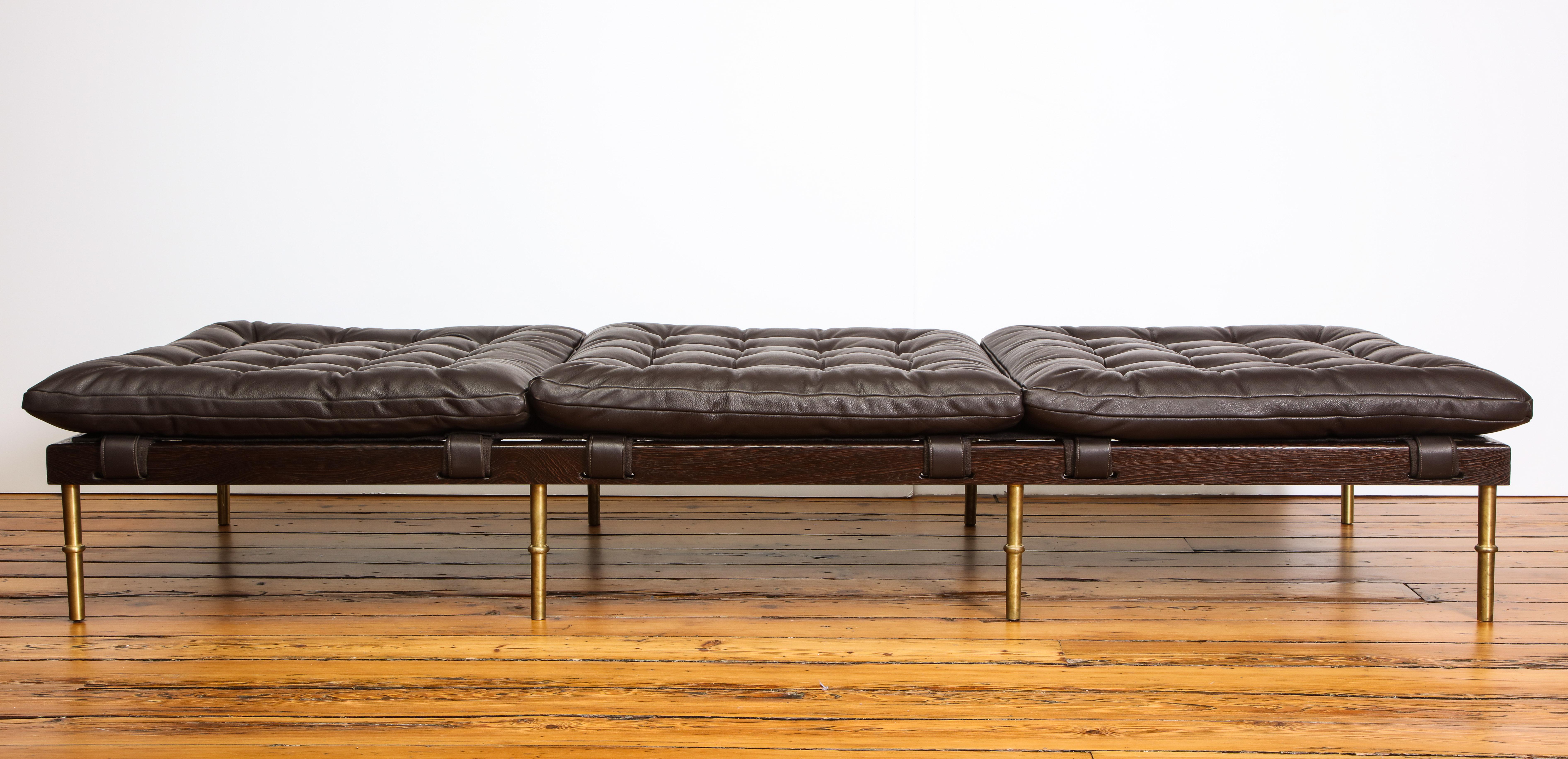 The Campanha collection displays DLV’s take on classical Campaign furniture. Infused with a rugged-meets-refined aesthetic, the collection’s tufted leather upholstery details are offset by careful and precise facets of gleaming turned brass and