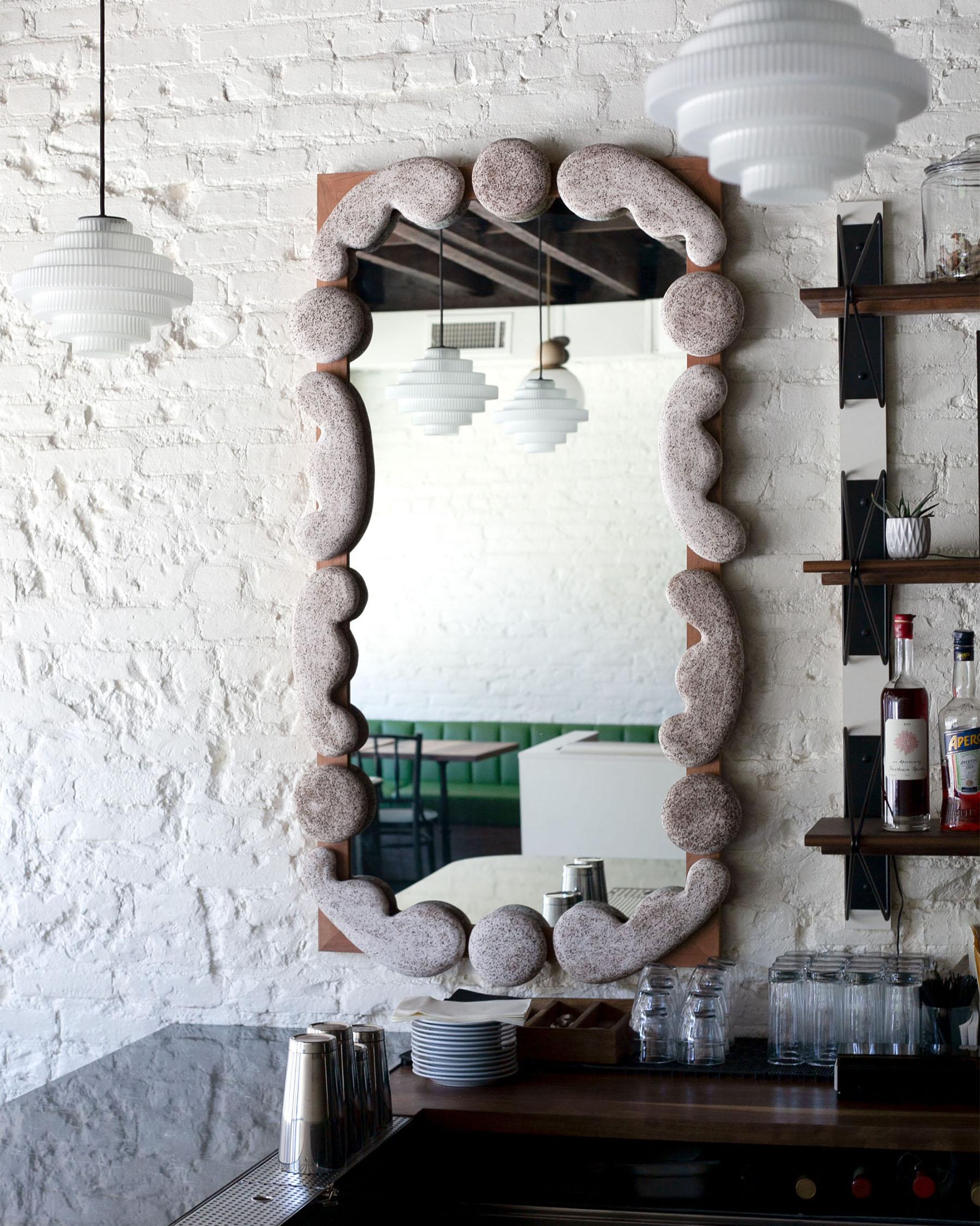 The Roebling Wall Mirror offers a contemporary take on the classical masonry and brickwork of Brooklyn with custom elements created in collaboration with Calyer Ceramics. 

Shown in white oak and speckled white ceramic finish. 

This piece can be