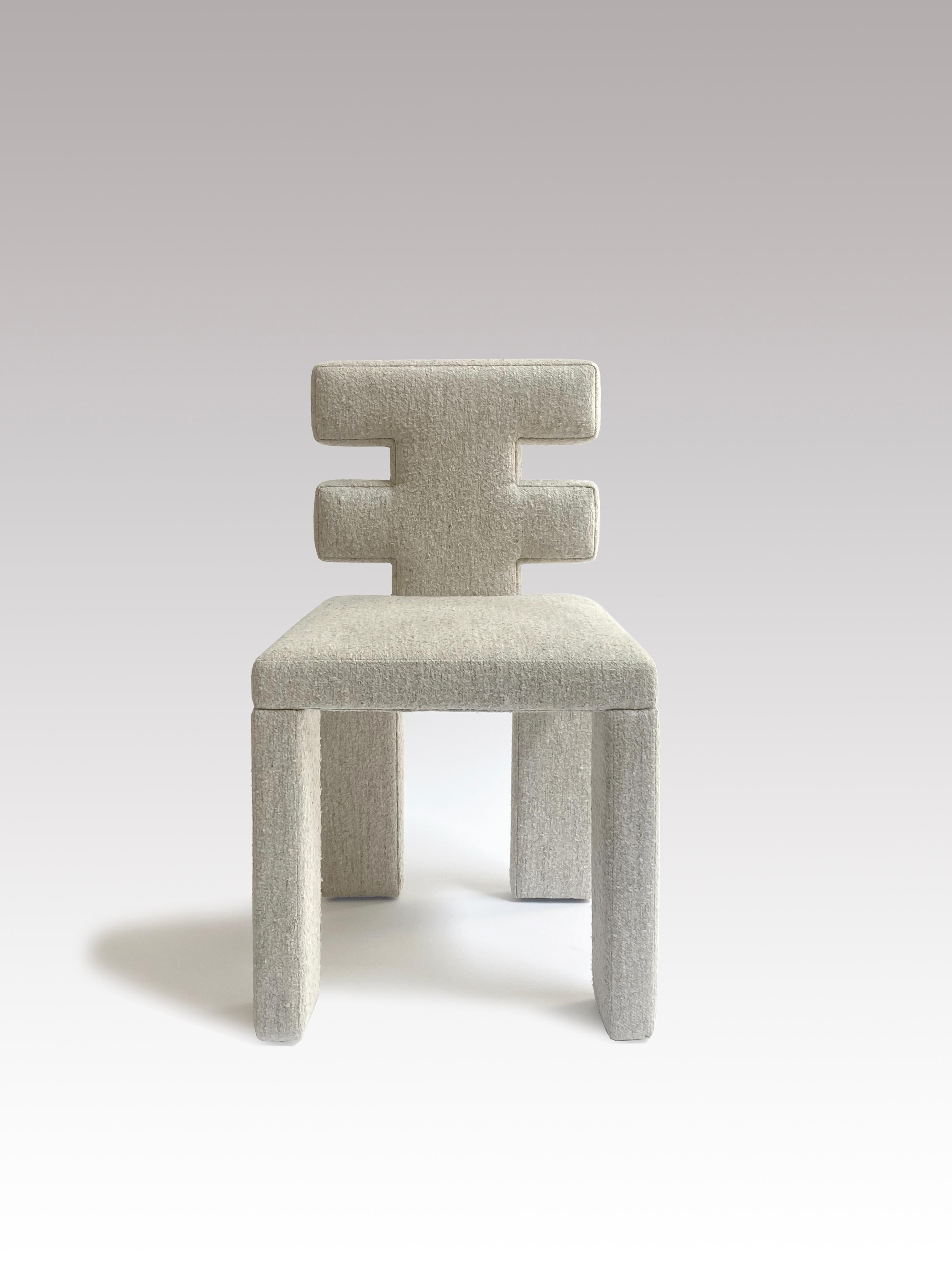 IN STOCK! Our newest Estudio Persona dining chair. A comfortable seat is partnered with a sculptural back and blocky, padded legs. A comforting softness combined with constructivist sturdiness, the H-chair makes a statement.

Upholstered in Wool