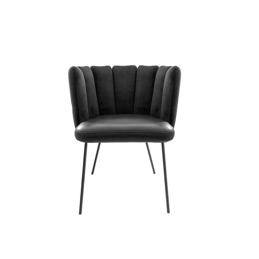 In Stock in Los Angeles

Set of 2 Black Gaia Velvet and Leather Upholstered Dining Armchairs.
The GAIA collection is a new creation designed by the well-known Italian designer Monica Armani.? GAIA’s sensuous shapes and tangible comfort are
