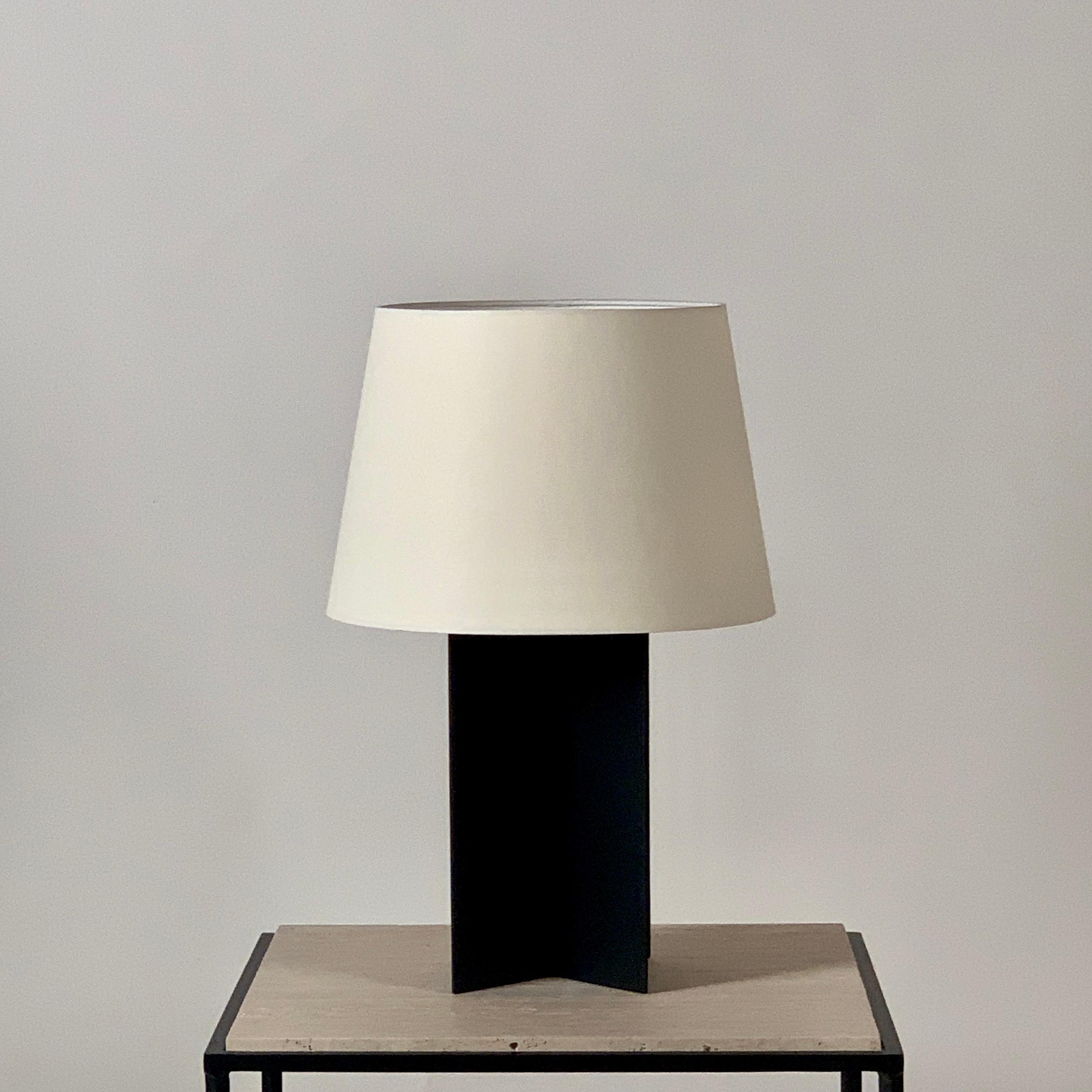In-stock large blackened steel and parchment paper shade ‘Croisillon’ lamp by Design Frères.

Attractive European style mount, with no finial showing. Custom parchment paper shade. Wired with twist cord and 3-way switch (on, 1/2 intensity, off). 40W