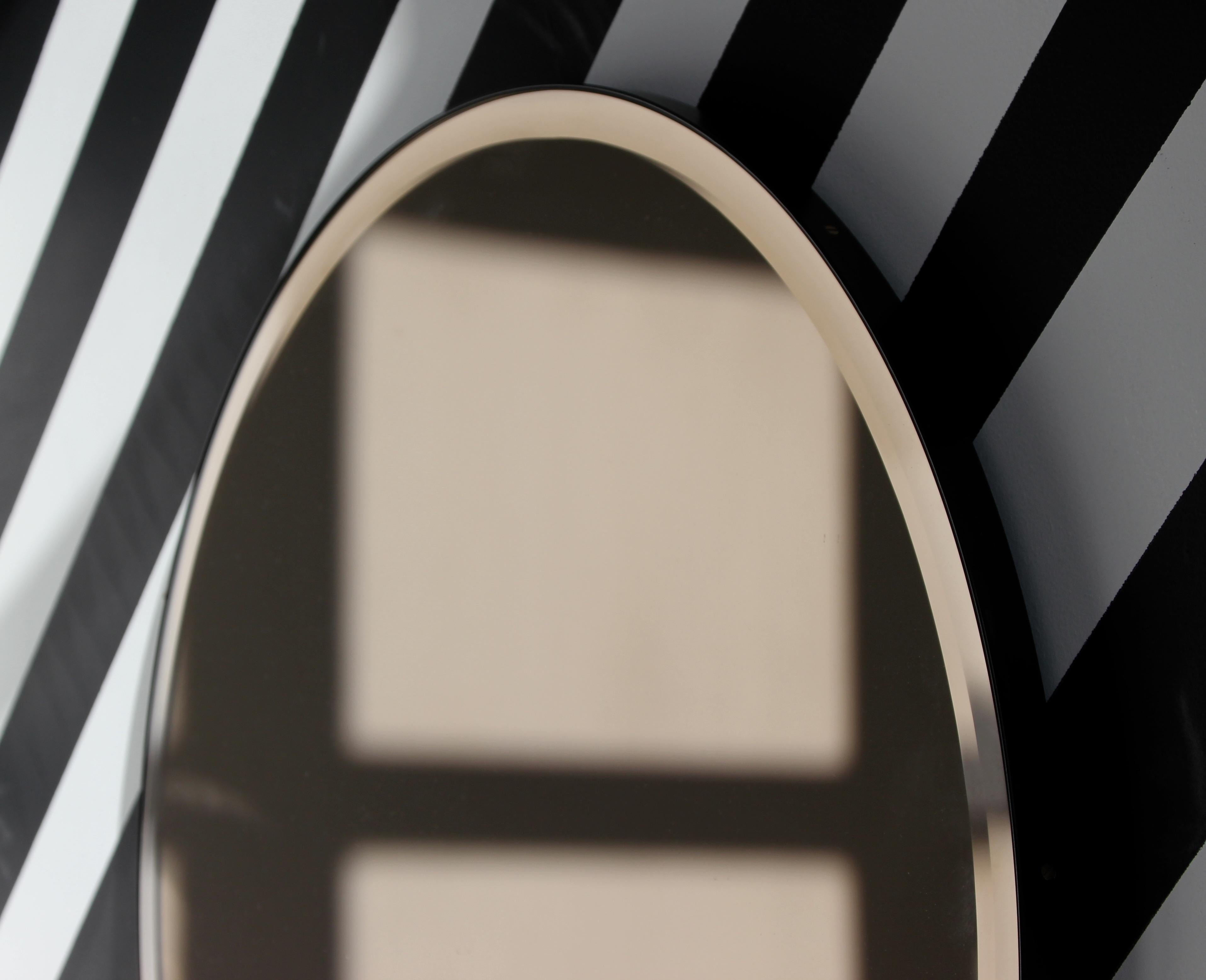 Aluminum In Stock Orbis Bevelled Bronze Tinted Round Mirror, Black Frame, Medium For Sale