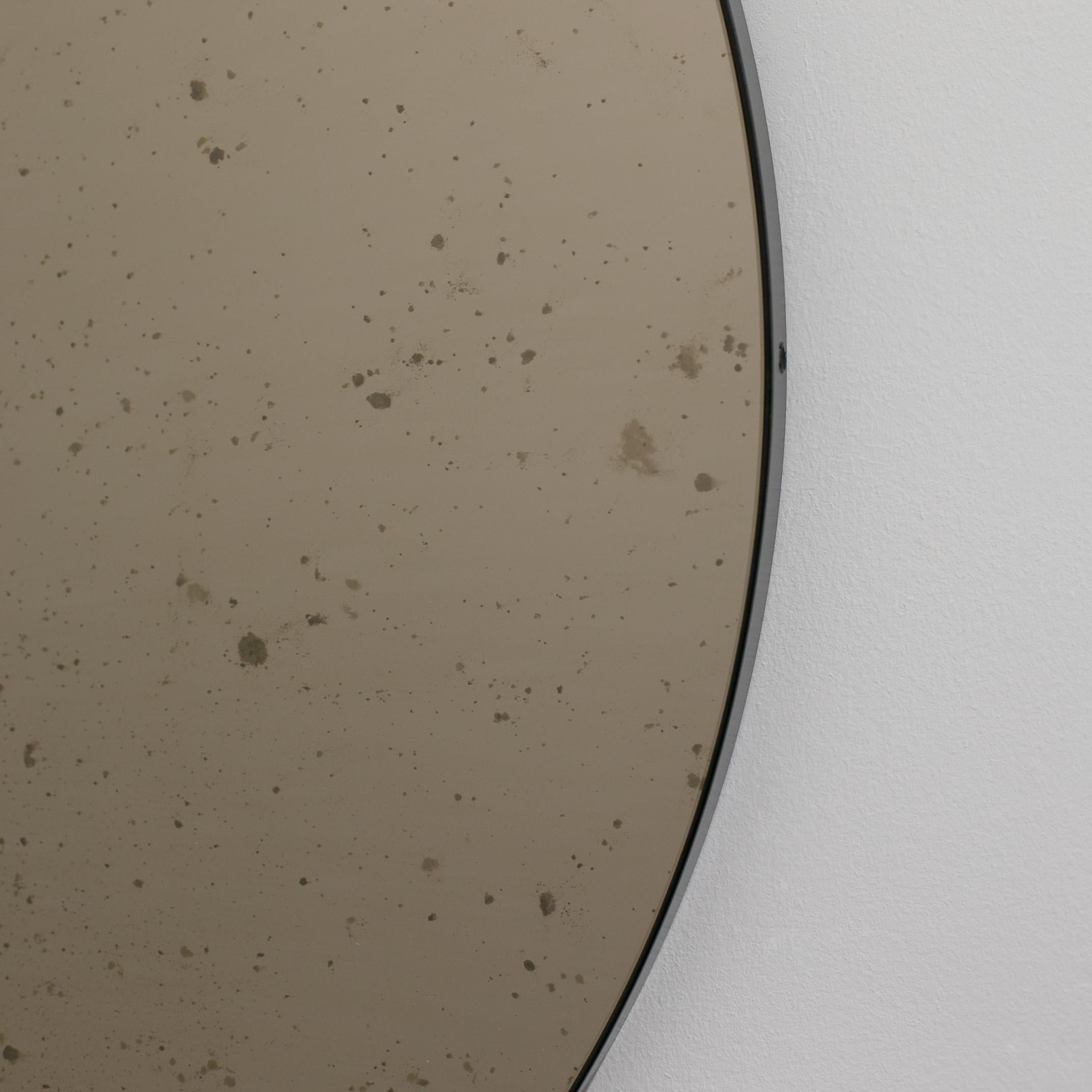 Organic Modern In Stock, Orbis Round Bronze Antiqued Modernist Mirror with Black Frame, Medium For Sale