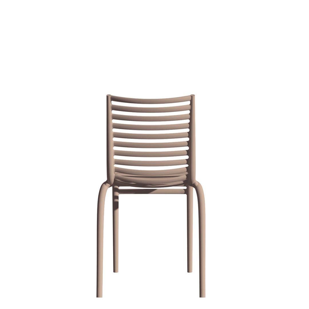 Designer
Philippe Starck – 2021
A contemporary riff on the classic “rail” chair, the PIP-e distills seat, back and arms into a single flowing grid of horizontal ribs. The result is airy transparency with strong chiaroscuro lines.
Care
Hose down or