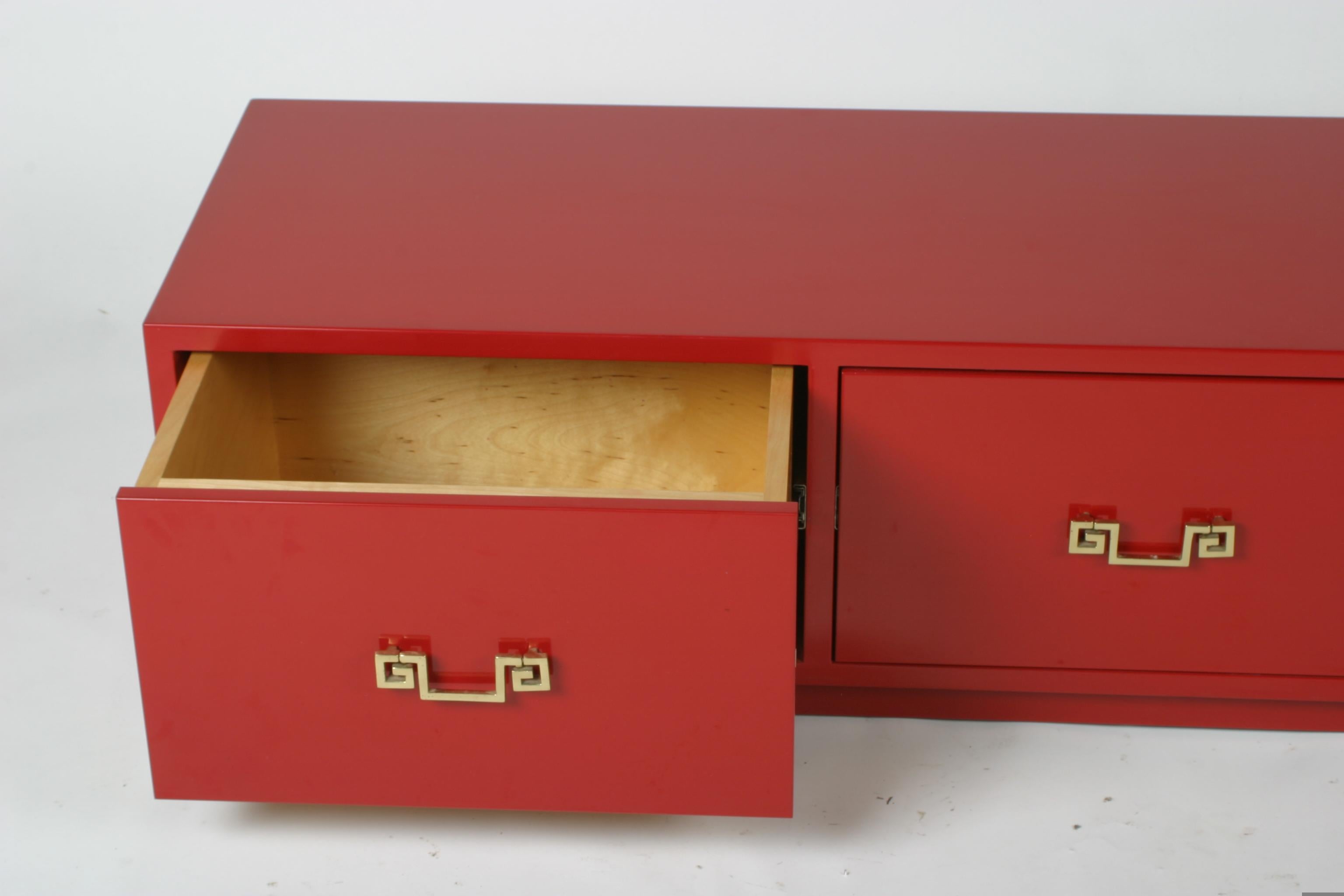 In Style of David Hicks Low Red Lacquer Chest of Drawers with Brass Handles In Good Condition For Sale In St. Louis, MO