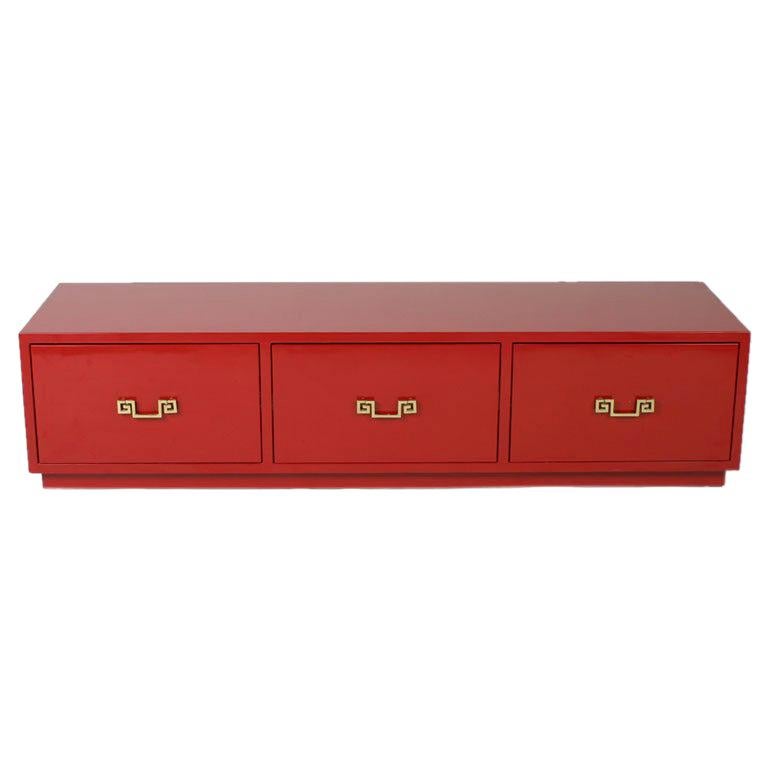 In Style of David Hicks Low Red Lacquer Chest of Drawers with Brass Handles For Sale