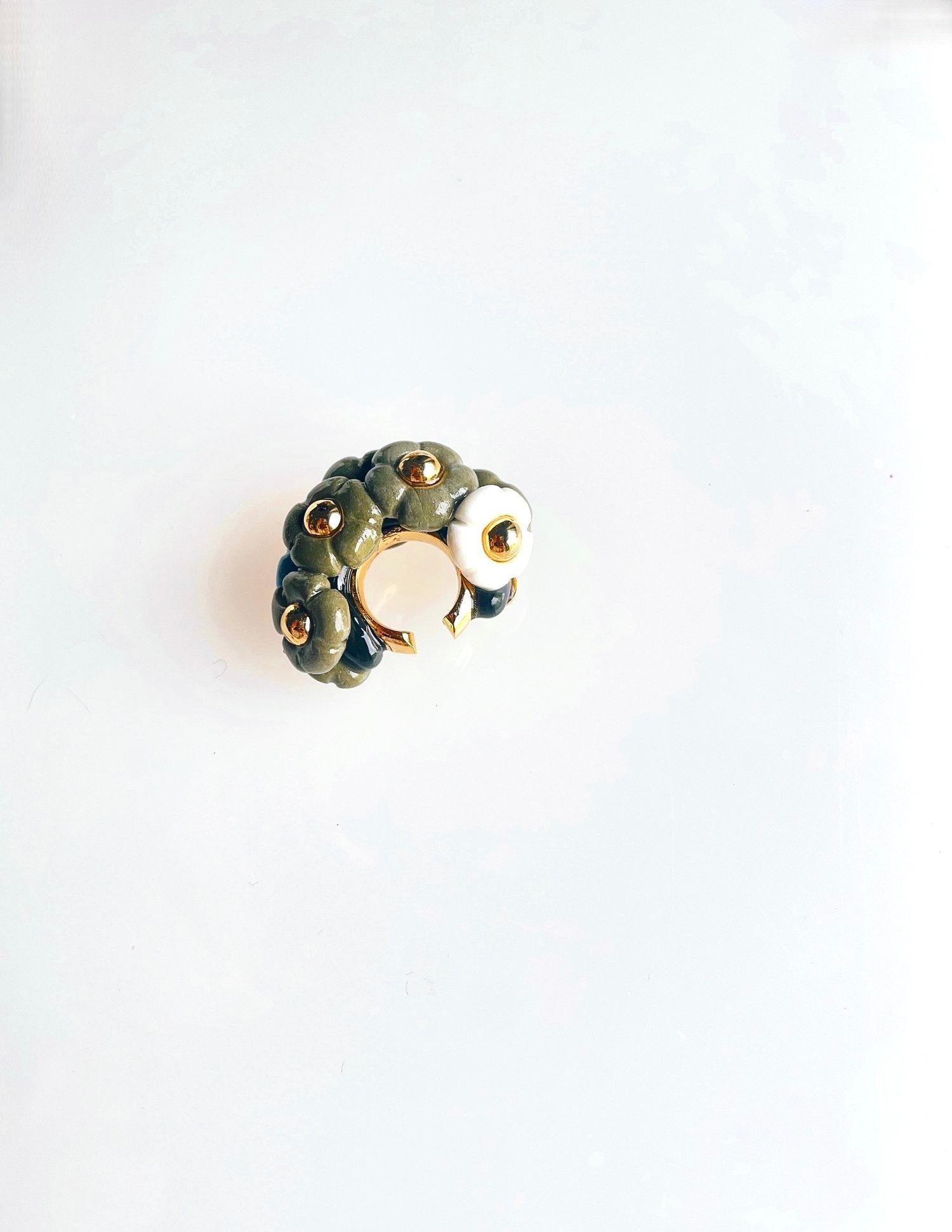 Work Serial No. 1110301235035

”BLOOMING AT NIGHT”

I was thinking of blooming flowers in the darkness at night when the nature wakes up.

SINGLE EAR-CUFF

This ear-cuff is sculpted and mixed in seven different color flower.

Each piece will be
