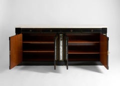 In the manner of Maison Jansen, Ebonized, Mirrored, and Parcel-gilt Console