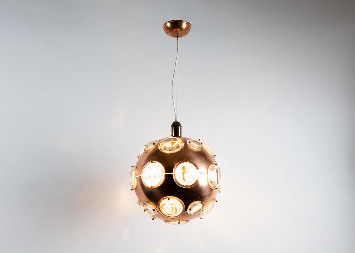 A playful, midcentury chandelier in copper, brass, and glass reminiscent of an early diver's helmet.