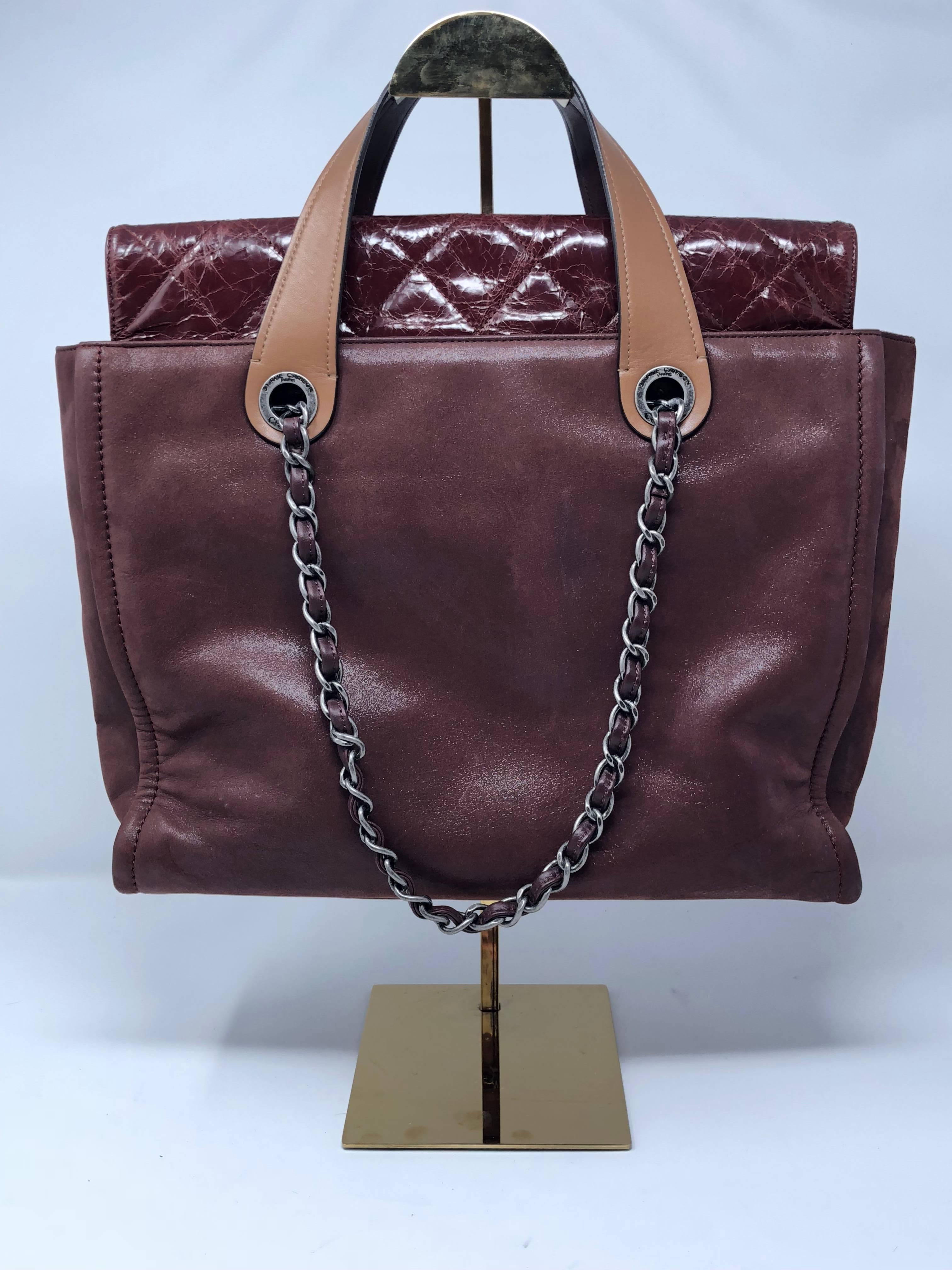 Chanel In the Mix Portobello Soft Tote Quilted Iridescent Calfskin in Burgundy. Good condition. From 2010-2011 collection. This versatile tote can be worn 2 ways and has aged silver-tone hardware and accents.  Handle drop is 2.5 inches. Strap drop