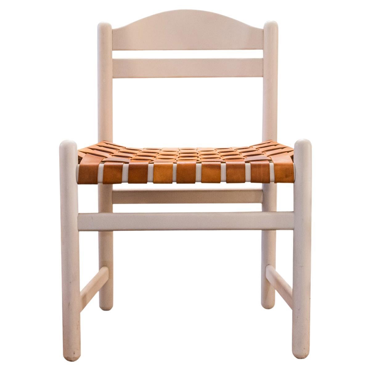 In the style of Carlo Scarpa, Suite of four chairs,
White lacquered wood,
Braided leather seat,
Rounded anterior and posterior uprights,
Lightly violated backrest,
circa 1970, Italy.

Measures : Height 77,5 cm, Width 52,5 cm, Depth 39,5 cm.
