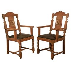 In the Style of Charles Dudouyt, two  Neo Rustique Oak Armchairs