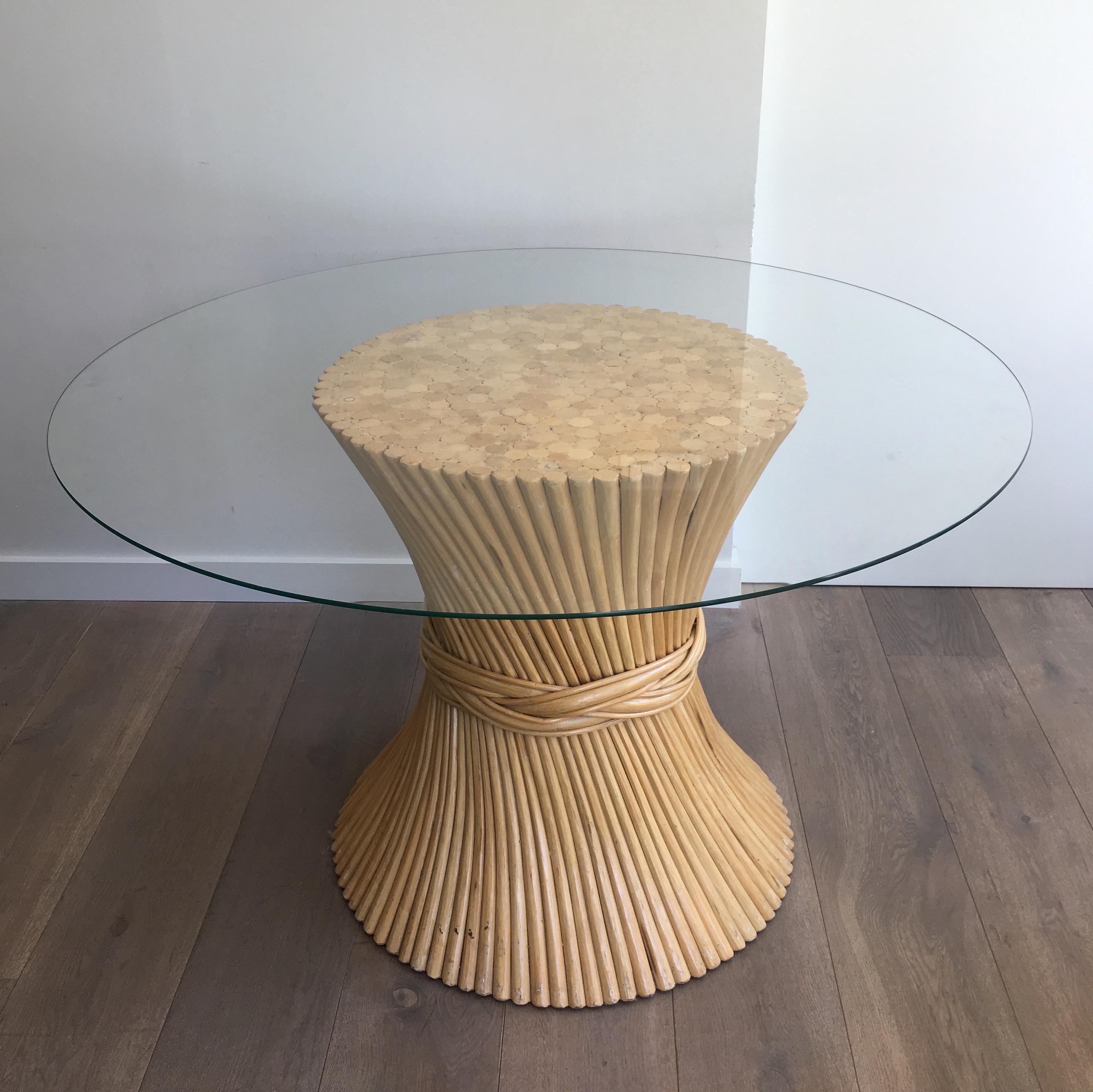 This round diabolo table is made of faux-bamboo wood. This is a very decorative piece with a very nice and stylish patchwork of woods on top. 