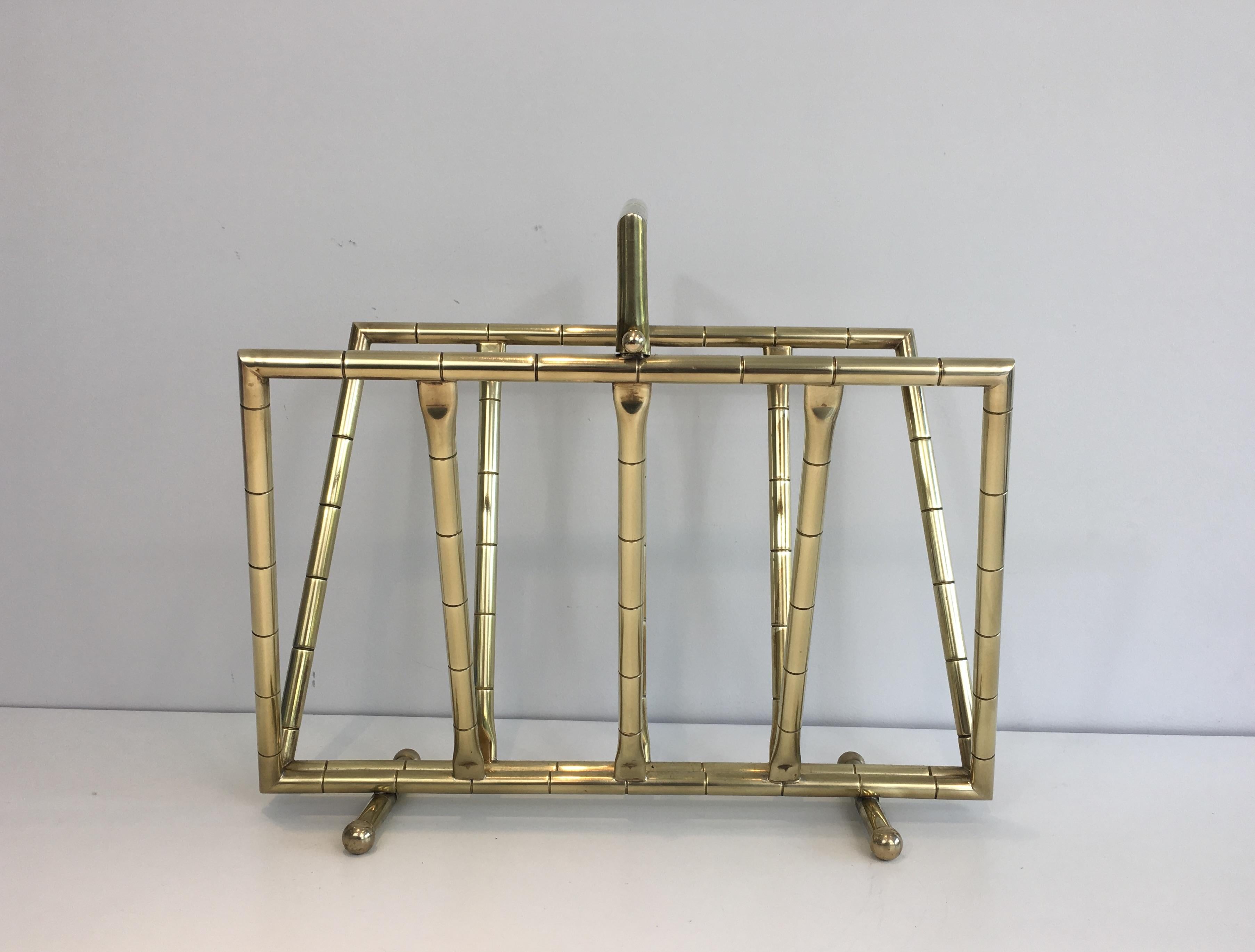 This nice design faux-bamboo style magazine rack is made of brass. This is a French work In the style of Jacques Adnet.Ccirca 1970.