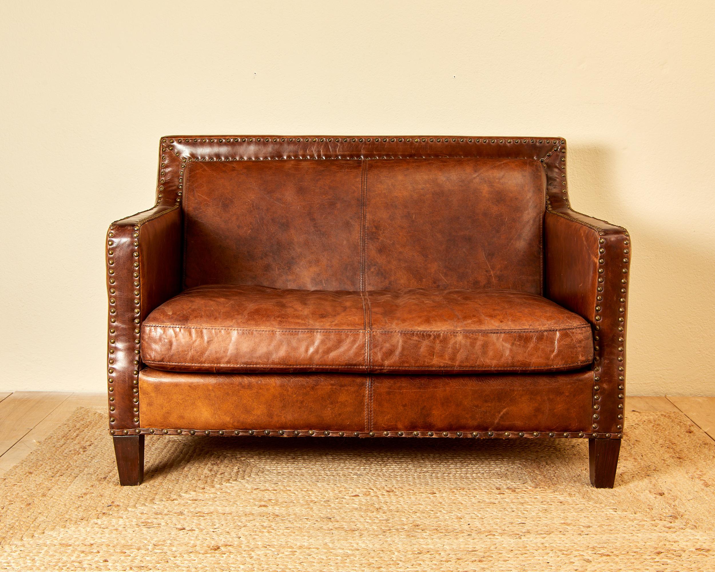 French In the style of Jean Michel Franck, leather sofa, circa 1930, France.