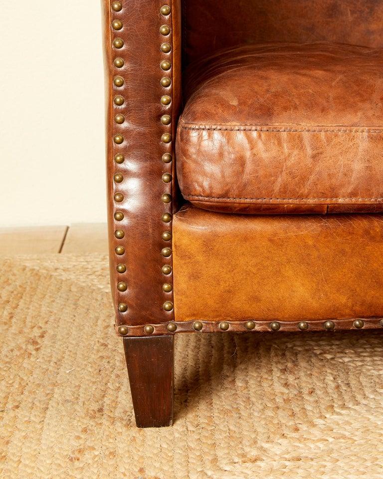 Leather In the style of Jean Michel Franck, leather sofa, circa 1930, France.
