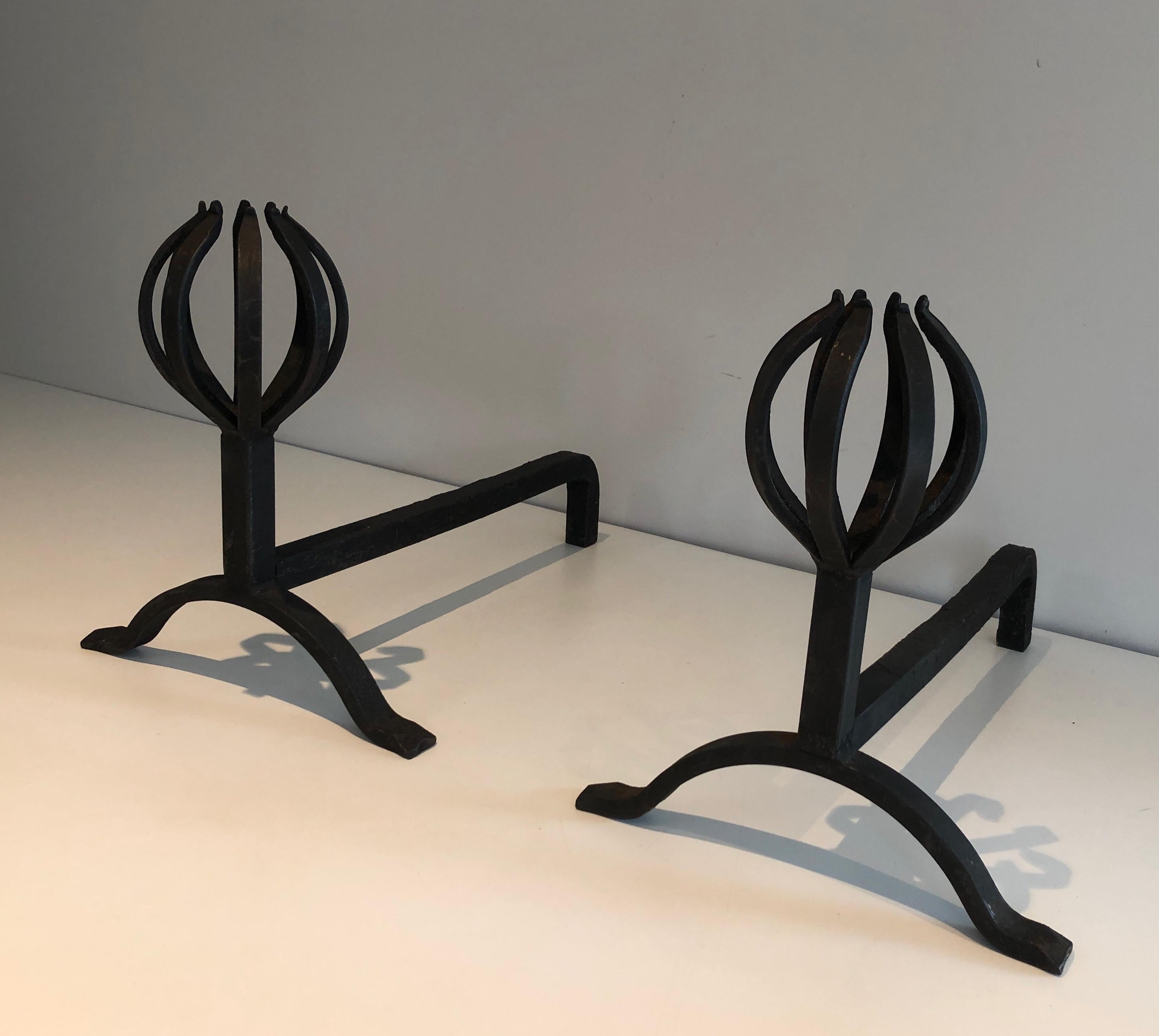 This very nice pair of andirons is made of wrought iron. This is a nice work, in the style of famous French designer Jean Royère, circa 1950.