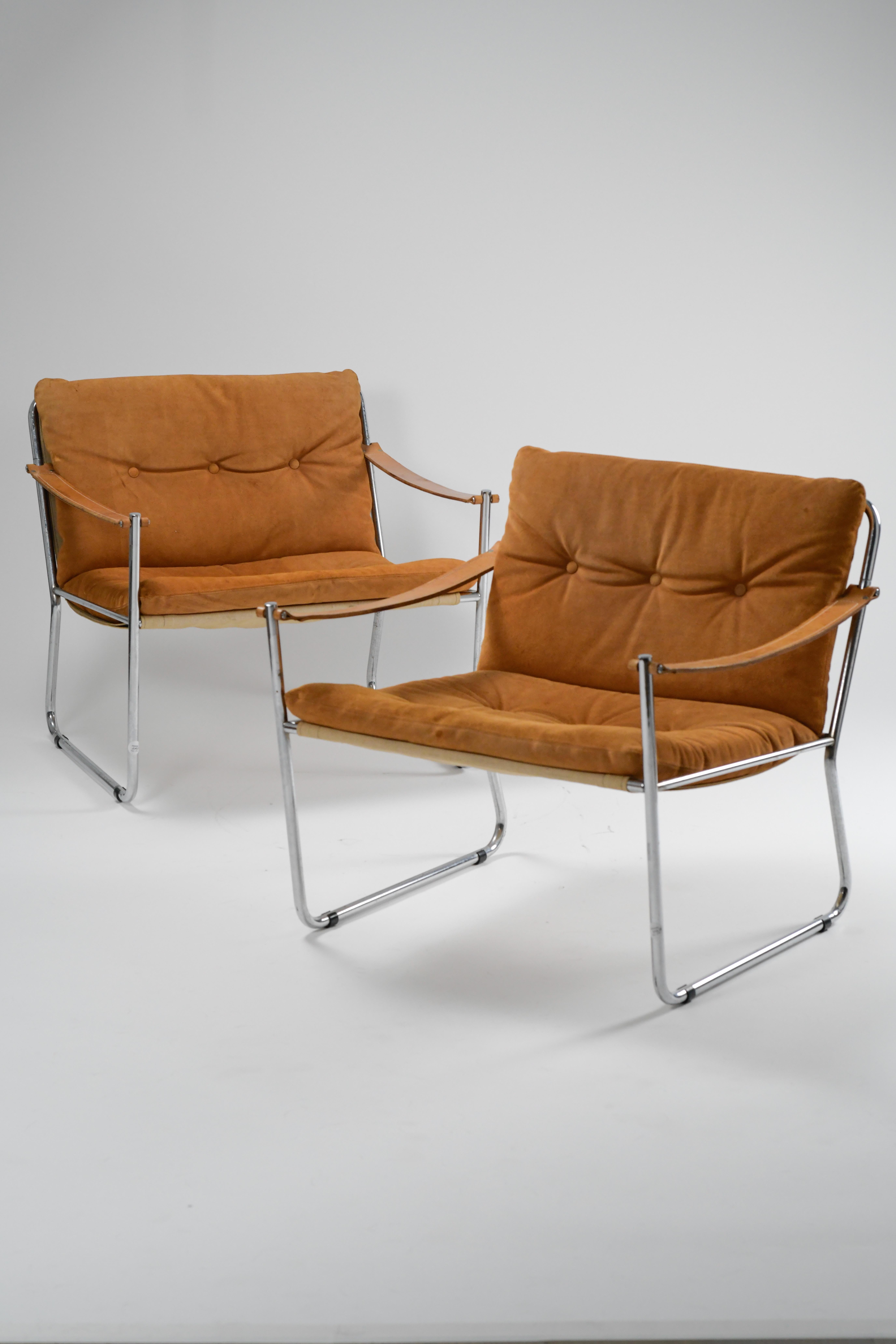 Beautiful pair of vintage 1970s lounge chairs. We are unsure about the maker of these but we believe them to be 'Amiral' chairs by Karin Mobring for Ikea. 

Made from incredibly light yet sturdy tubular steel frames, canvas supports, padded suede