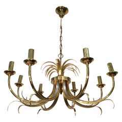 In the Style of Maison Charles. Gilt Metal, Brass and Steel 8-Light Pineapple