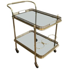 In the Style of Maison Jansen, Neoclassical Brass Bar Cart with Blueish Glass