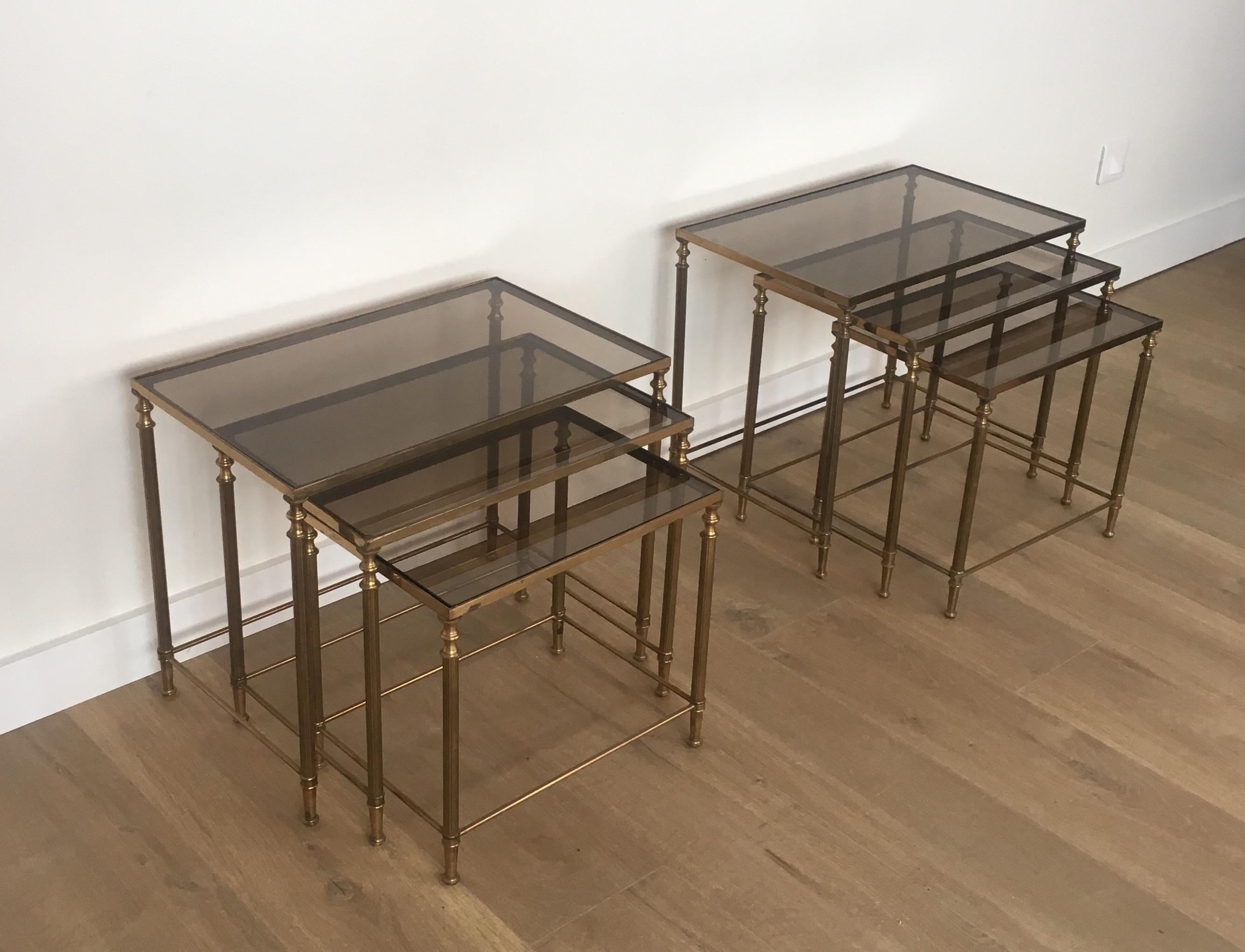 French In the style of Maison Jansen. Pair of Neoclassical Nesting Tables Sets in Brass