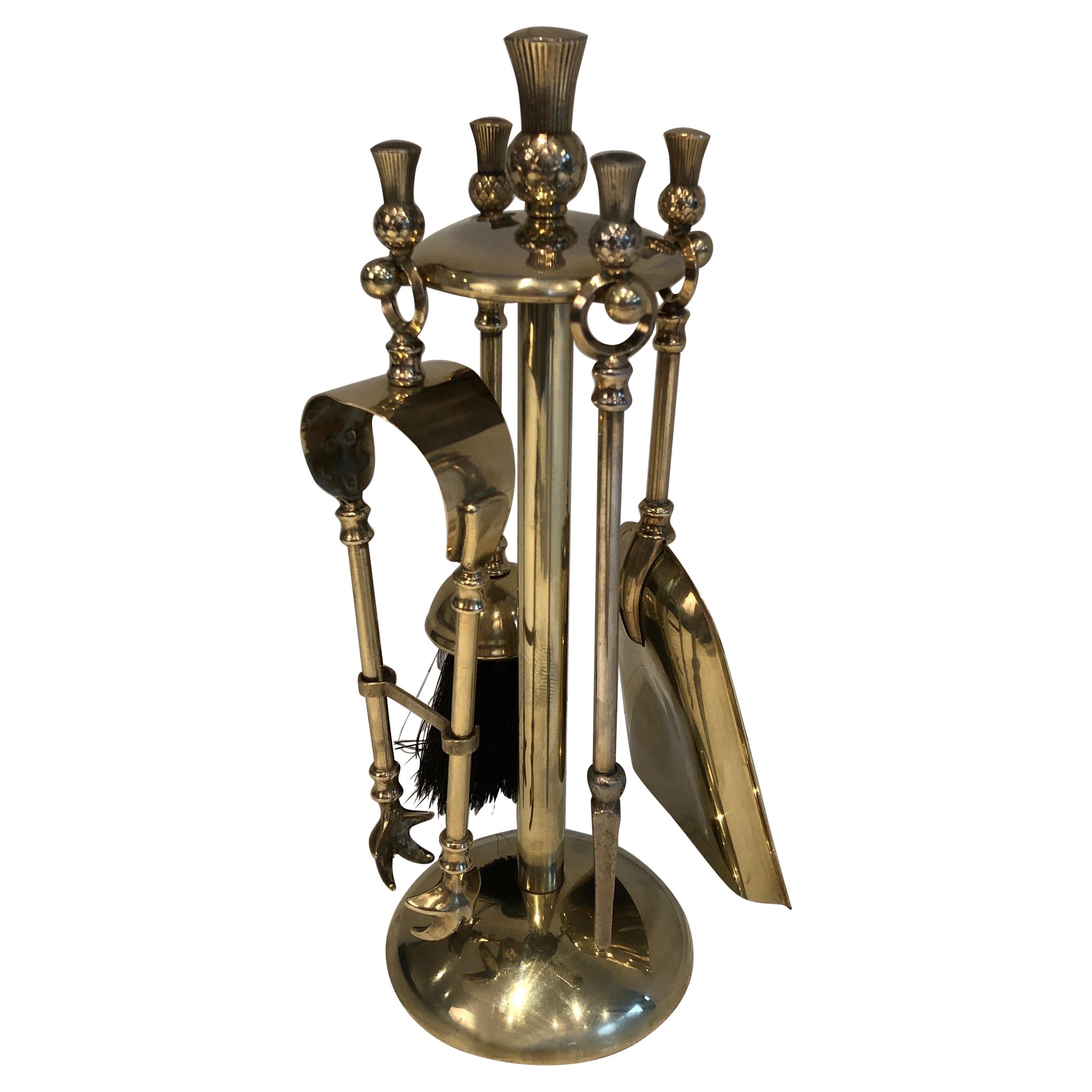 This pineapple low fire place tools on stand are made of brass. This is a French work, in the style of famous Maison Jansen, circa 1970.