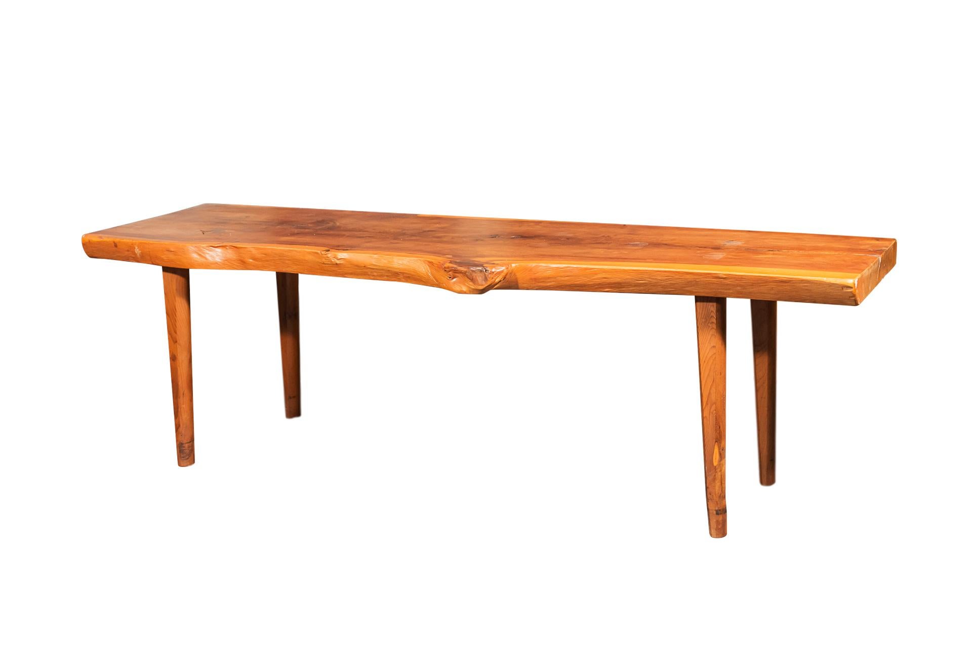 In the style of Nakashima,
Brutalist coffee table,
Wood,
France, circa 1960.

Measures: Width 125 cm, depth 38 cm, height 39 cm.