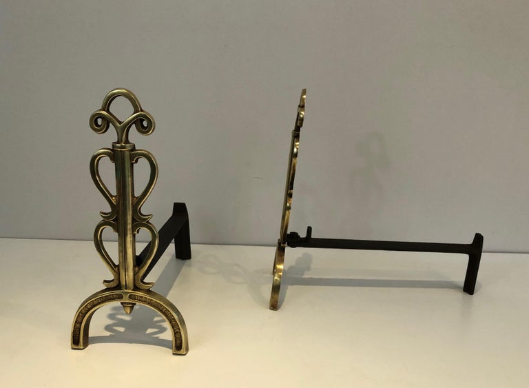 In the Style of Raymond Subes, Pair of Brass and Wrought Iron Andirons, French In Good Condition For Sale In Marcq-en-Barœul, Hauts-de-France