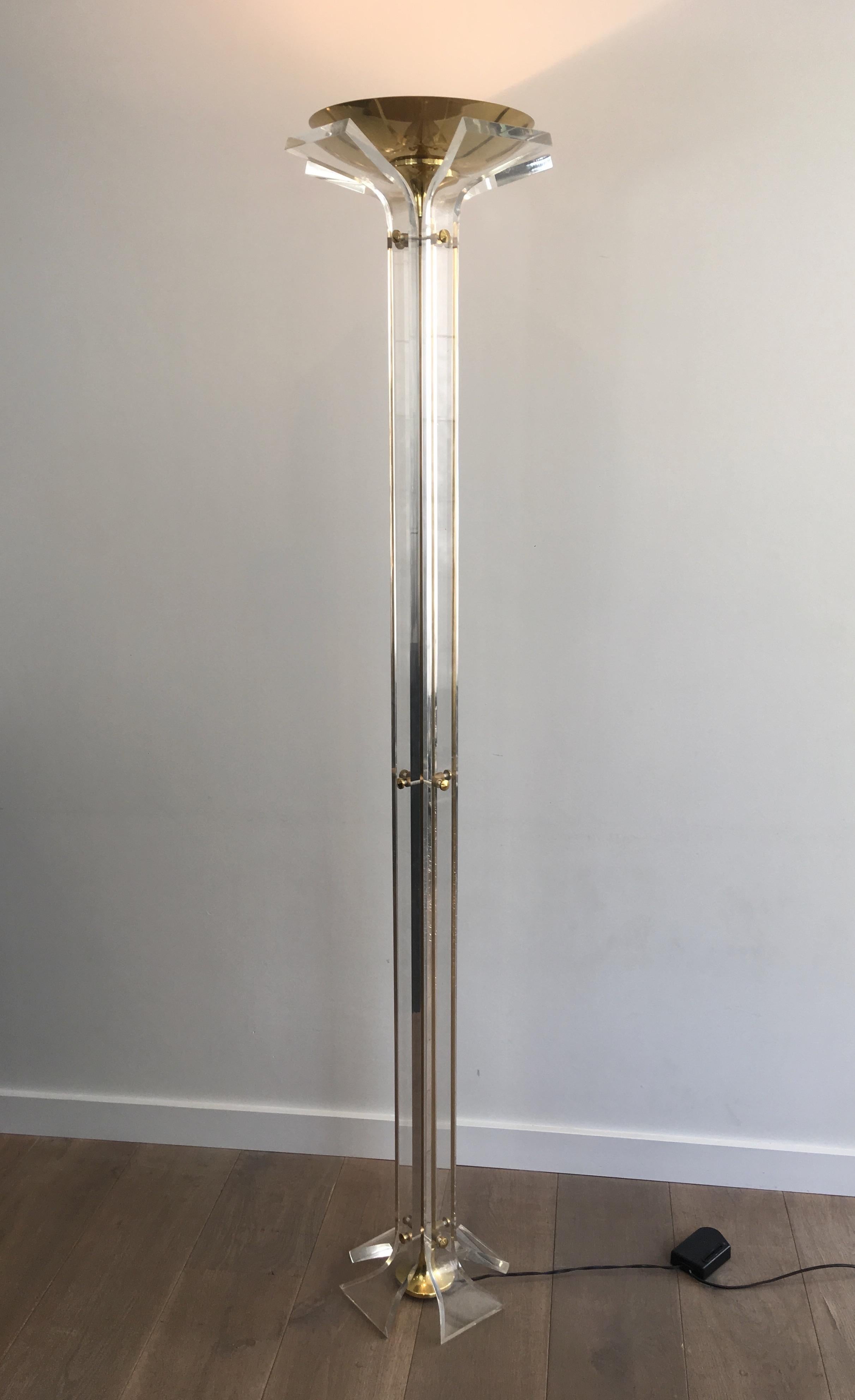 This rare and very nice floor lamp is made of Lucite and gilt brass. This is an Italian work, in the style of famous designer Romeo Rega, circa 1970.