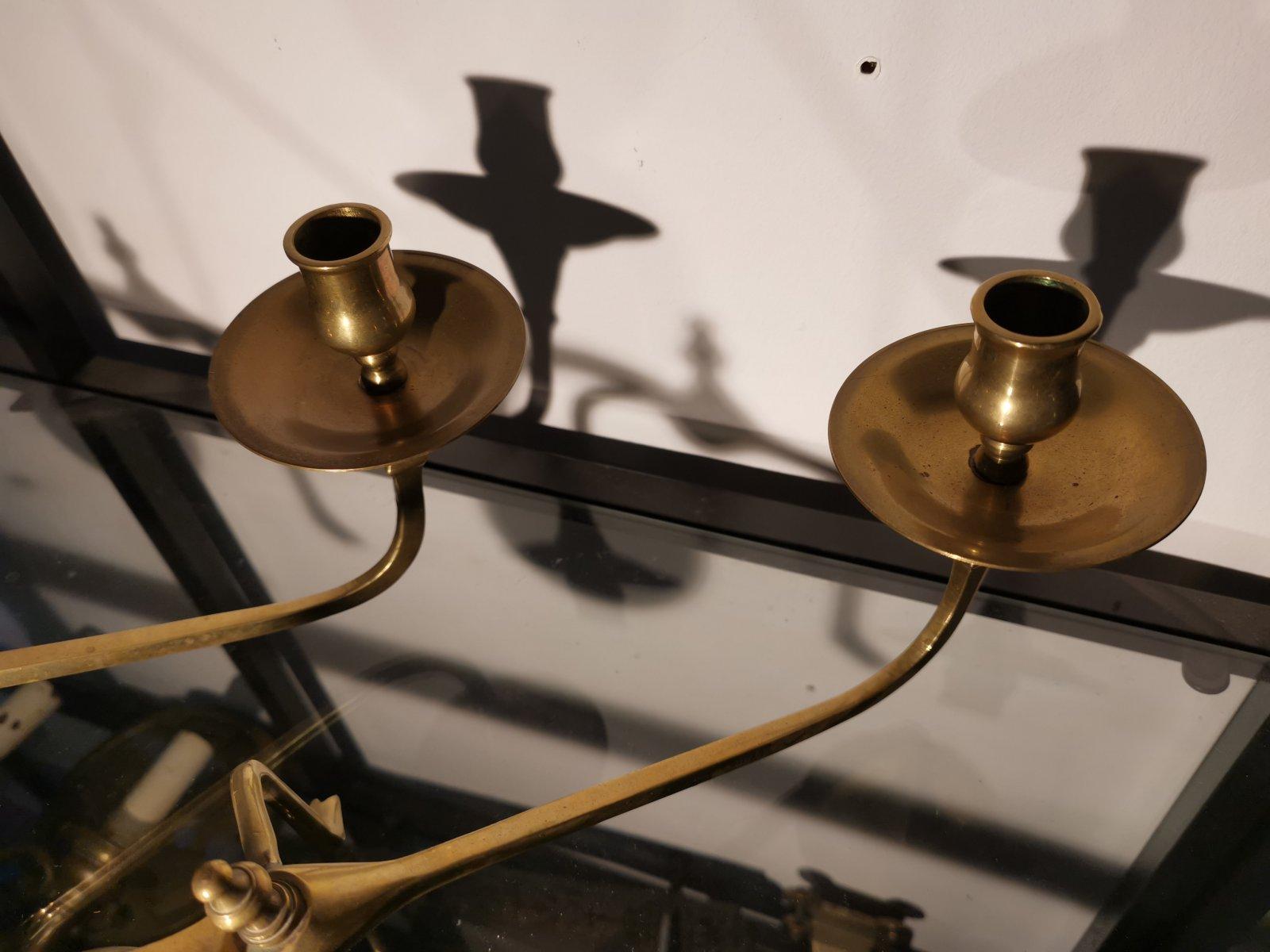 Arts and Crafts In the Style of Was Benson, A Pair of Brass Arts & Crafts Piano Candle Holders.