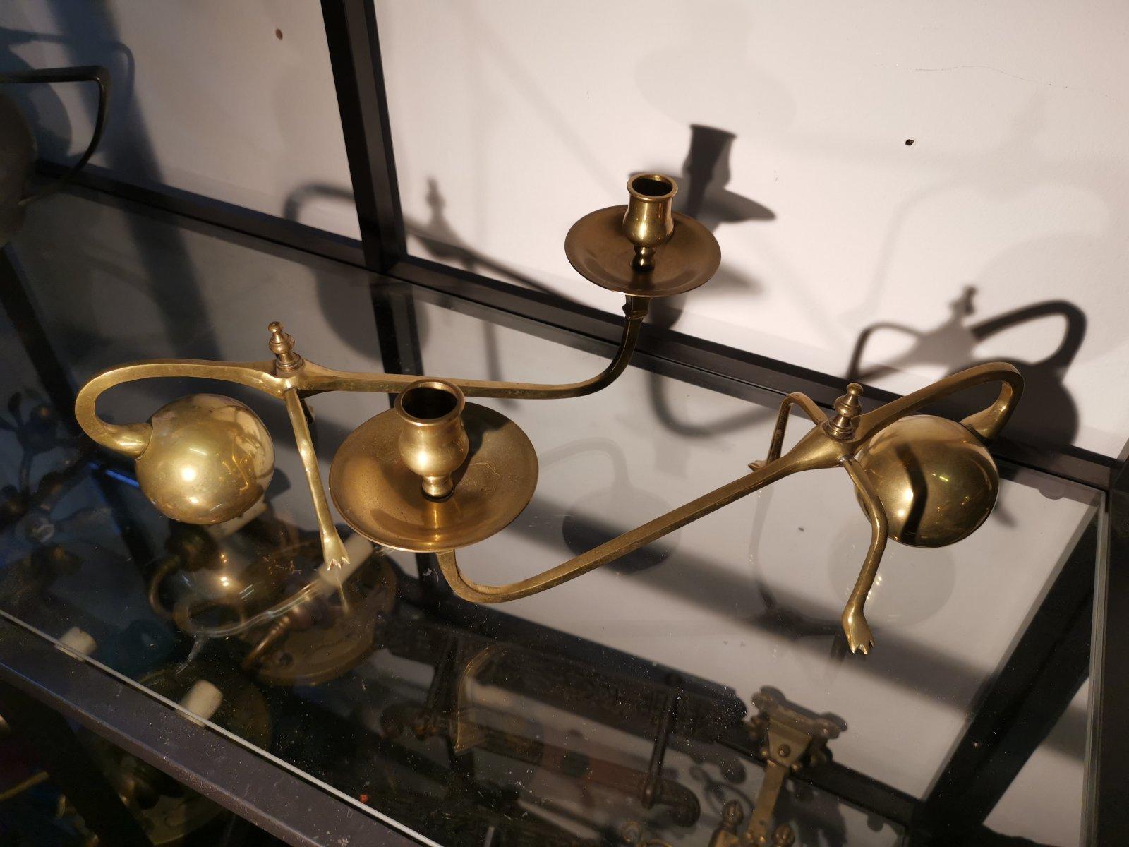 20th Century In the Style of Was Benson, A Pair of Brass Arts & Crafts Piano Candle Holders.