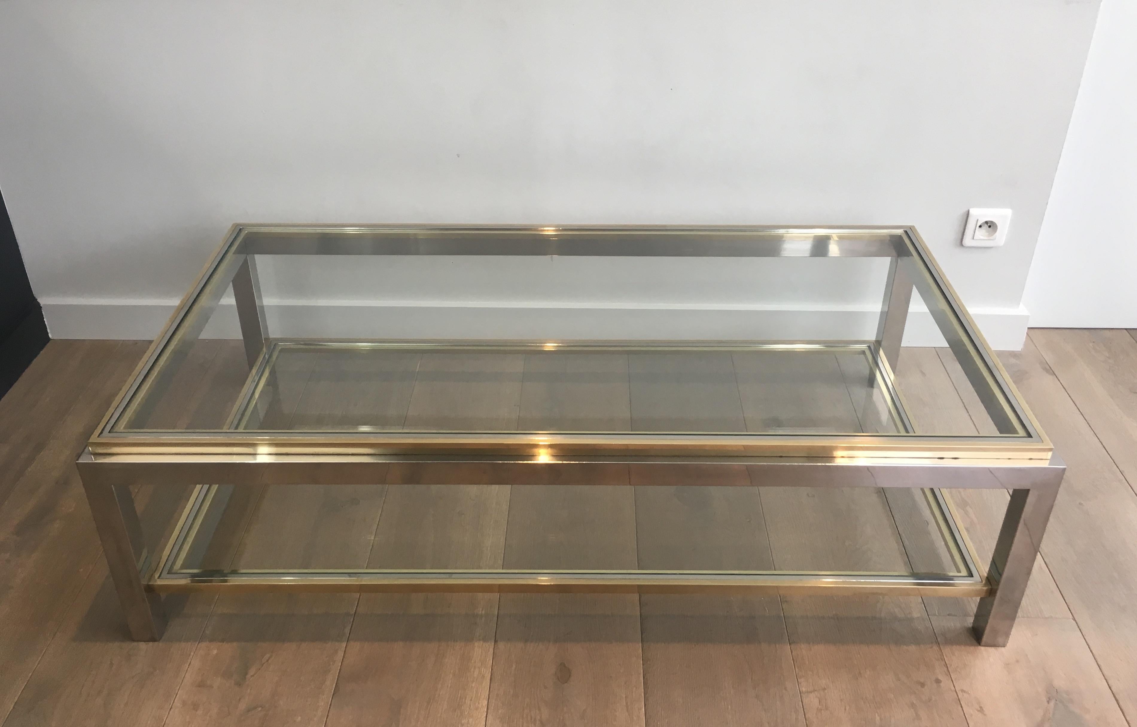This very nice coffee table is made of chrome and brass. The quality of this cocktail table is very good. This is a French work, circa 1970.