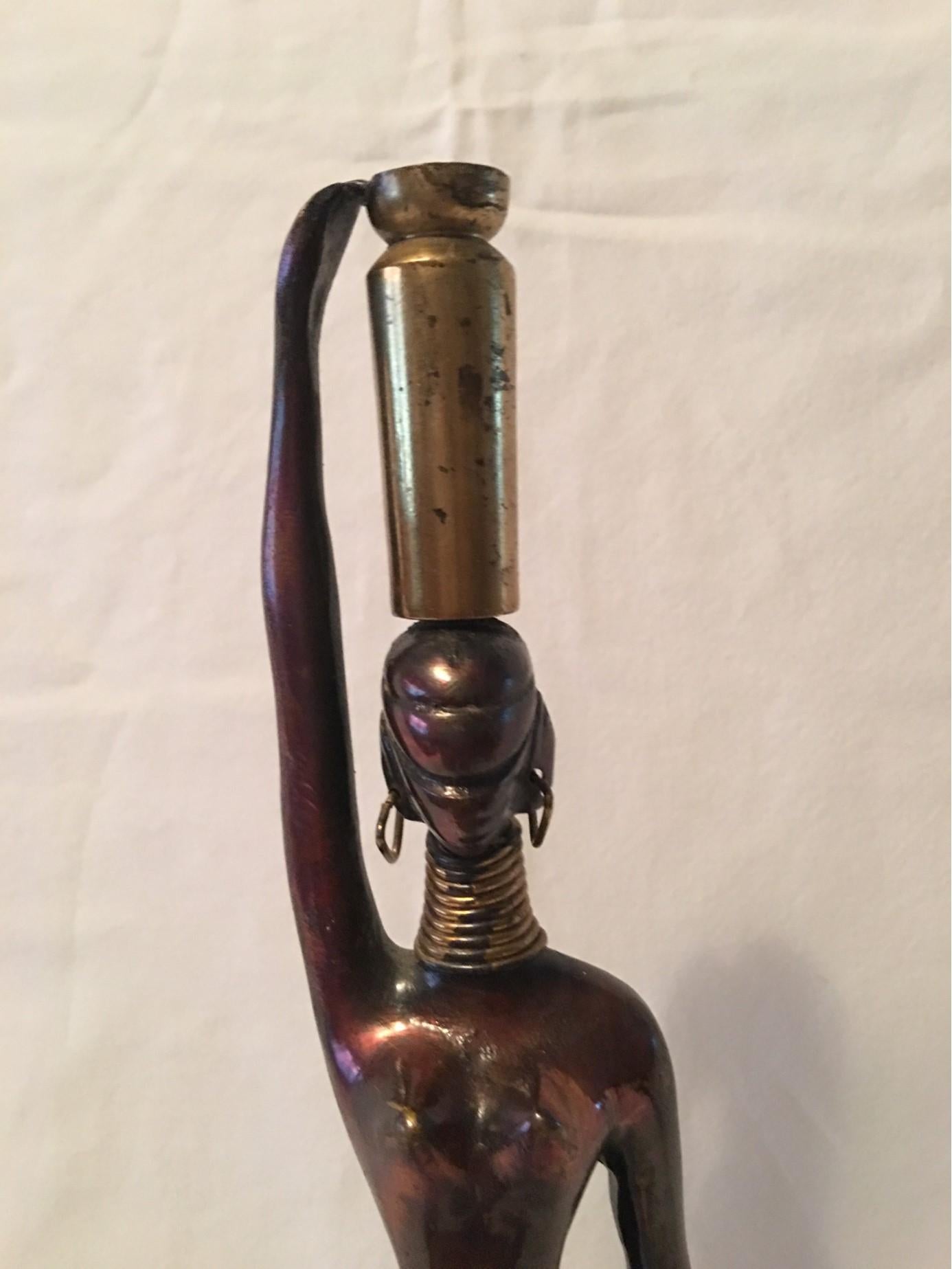 Elegant conversation piece for any room. A bronze statue of a graceful African Woman, in the style of Karl Hagenauer. A great conversation piece.
Will be shipped from Europe to Buyer. Any questions will be happily answered from our USA location.