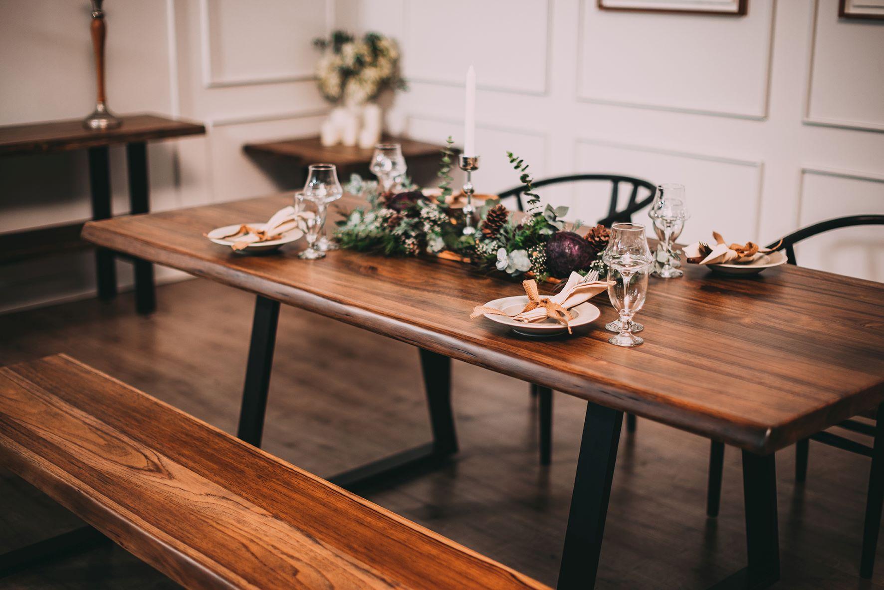 Have it in your home in time for the holidays! This beautiful solid teak live edge 72x38 table is stained in our Autumn with a smooth finish. The legs are black powder-coated steel in a flared design.

Your table will have unique characteristics,