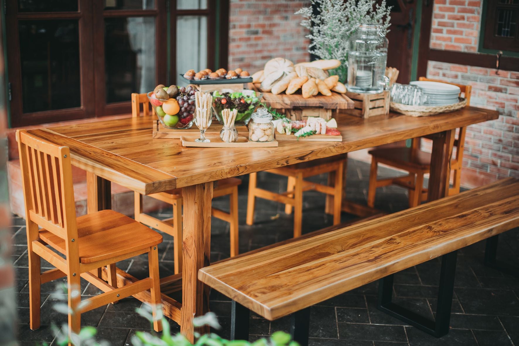 This beautiful 96x40 solid Burmese teak dining table is beautifully finished in a smooth natural. The charm of the Alene table brings a modern sense of rural retreat into your home. Gorgeously crafted solid wood top crowns a wood beam base that