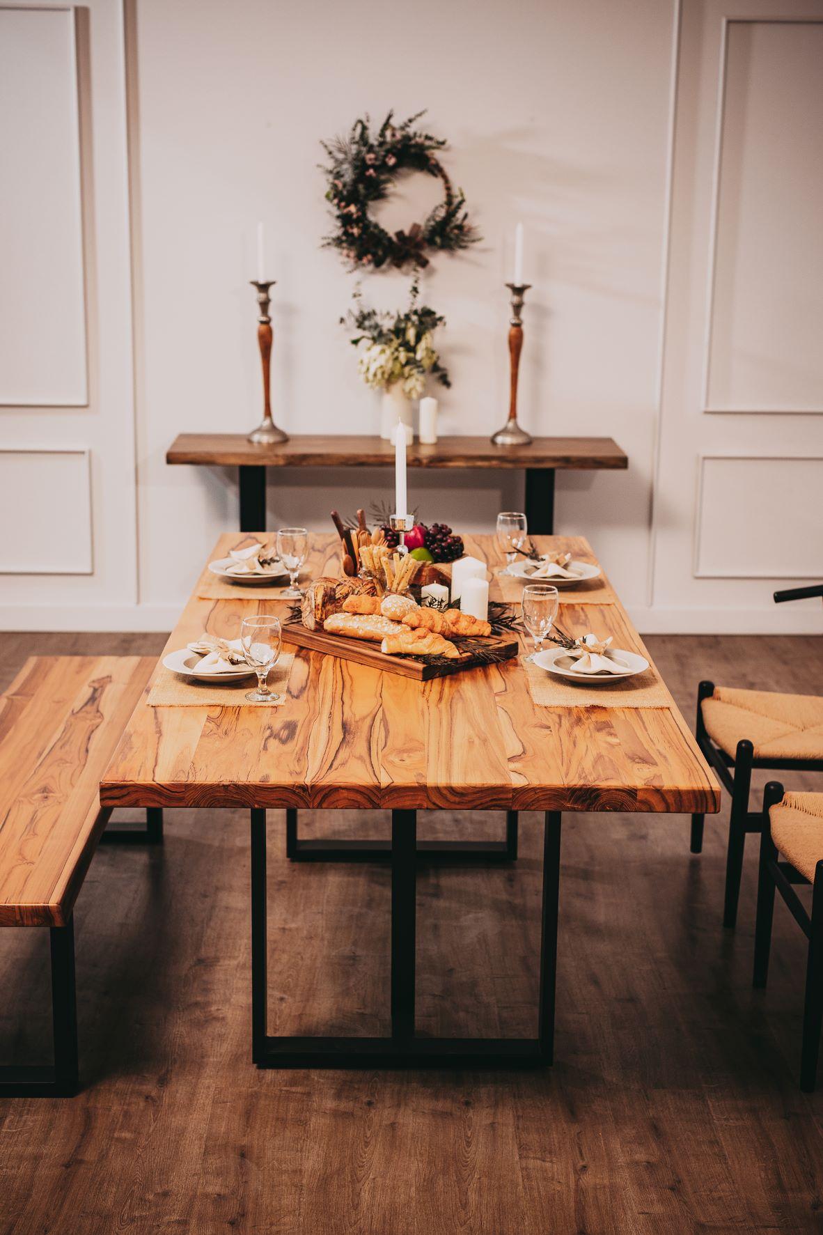 This 84x40 dining table is expertly hand-crafted and finished in solid Burmese teak with a smooth natural finish. The sturdy legs are black powder-coated steel in our small open corner design.

Your table will have unique characteristics, such as