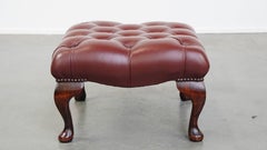 In very good condition elegant red/brown chesterfield cowhide ottoman