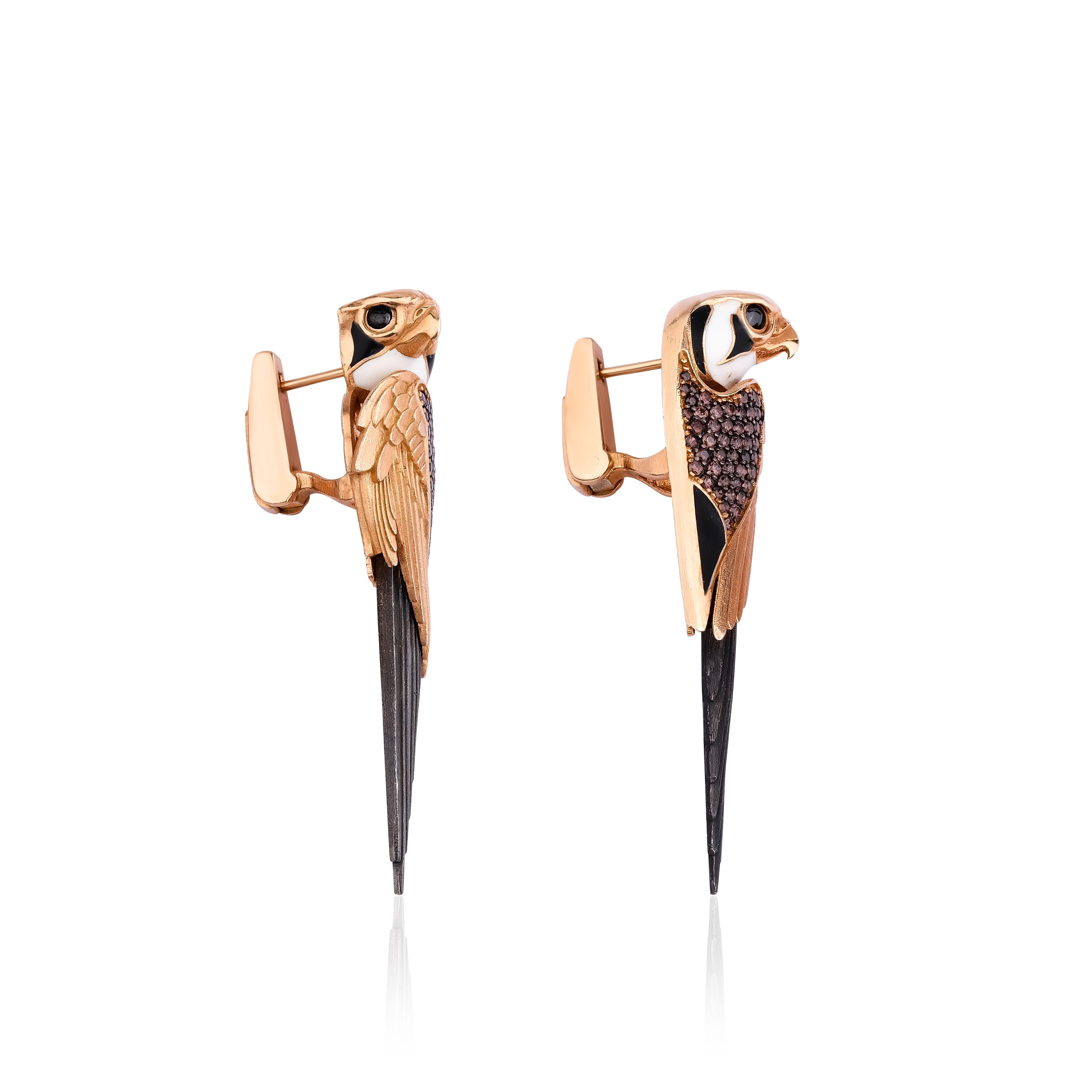 These extraordinary earrings have been expertly crafted to capture the essence of the magnificent Osiris falcon from ancient Egypt. Every intricate detail has been meticulously attended to, resulting in a truly captivating design. The falcon's