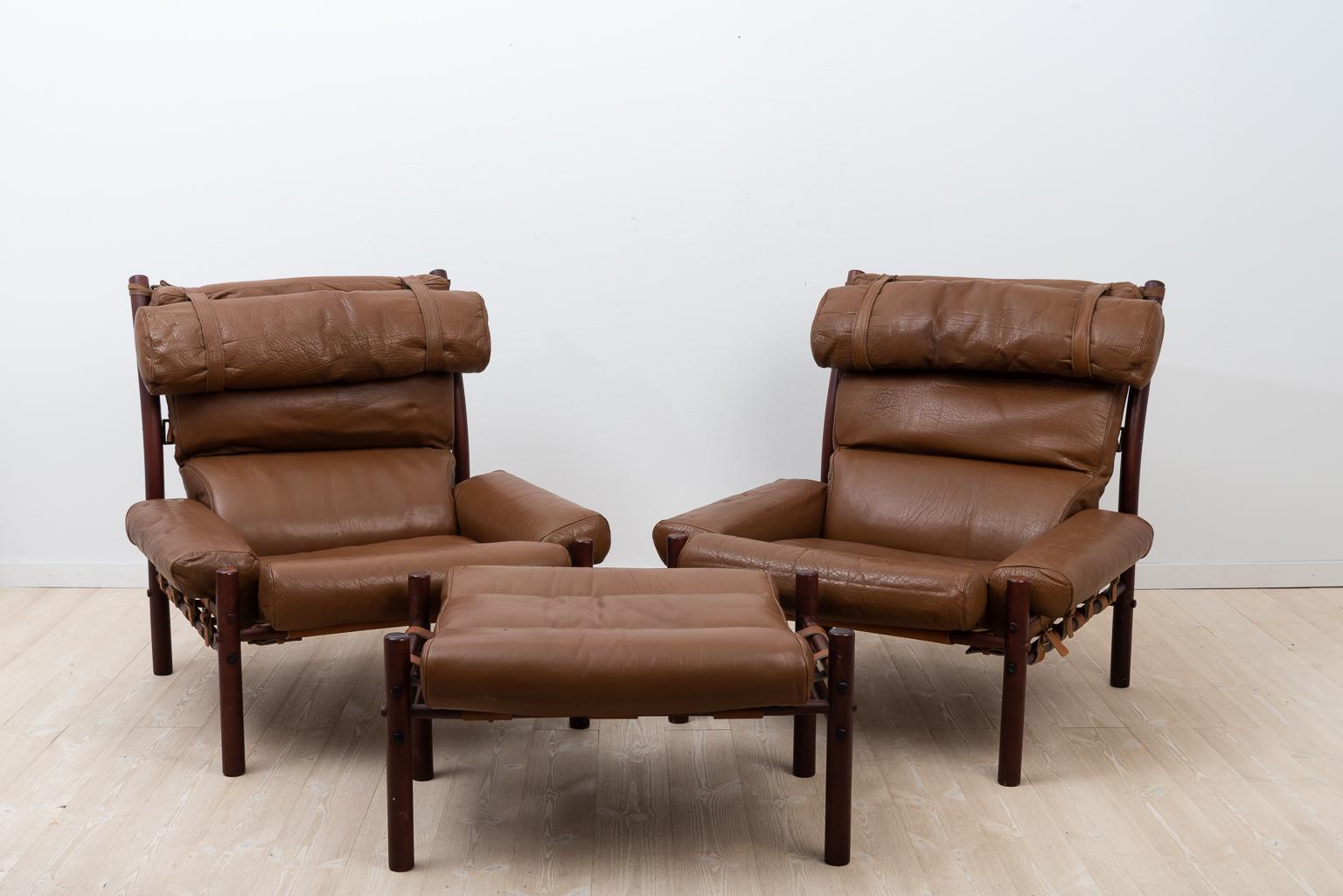 Set of two inca armchairs and appurtenant ottoman. Designed by Arne Norell in 1971 and produced by Norell Möbler during the 1970s. 

The upholstery is the original dark brown, buffalo leather and it's in very good condition. The frames are