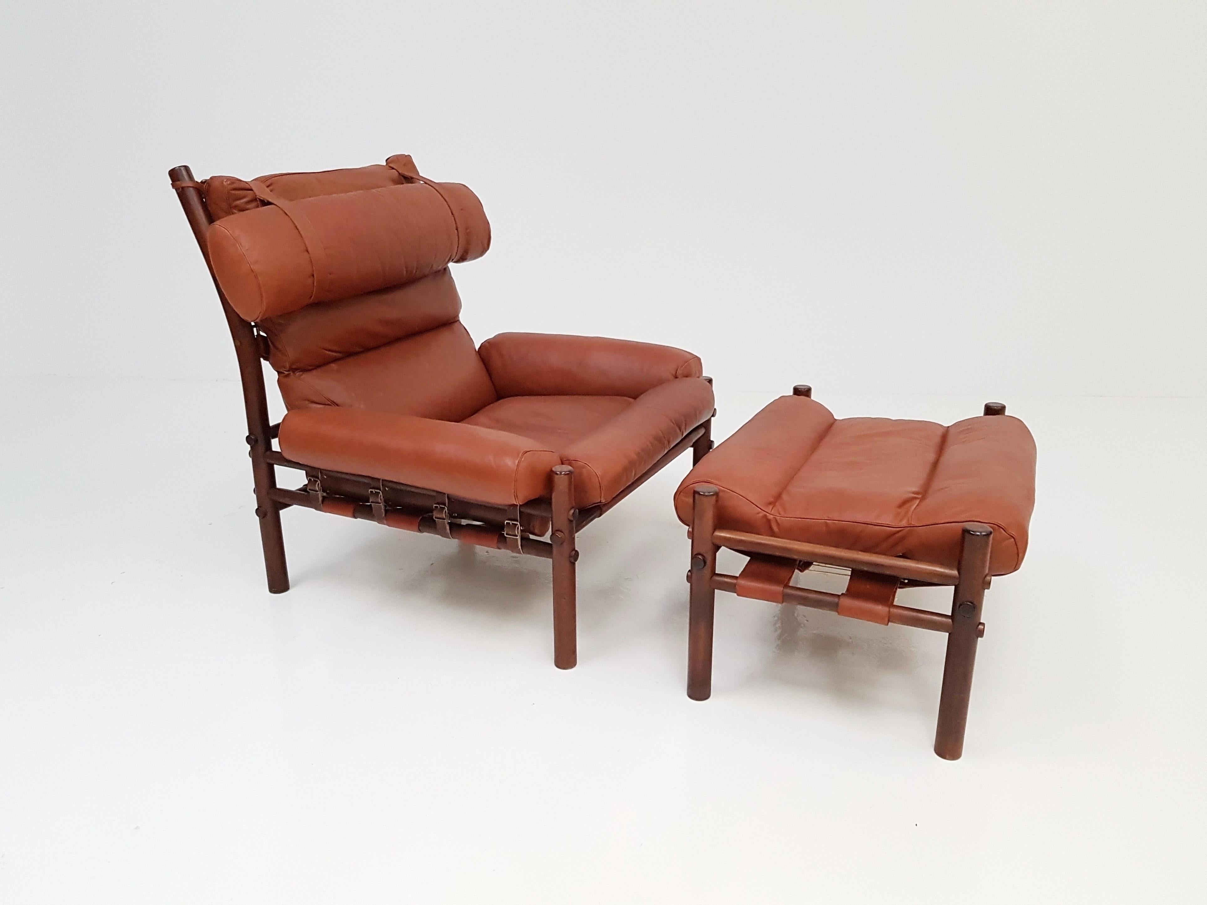 An iconic Inca chair and footstool by Swedish designer Arne Norell for Norell Möbler from the 1970s. An extremely comfortable chair which also looks amazing. The piece is in good vintage condition.

Consists of a stained beech frame with leather