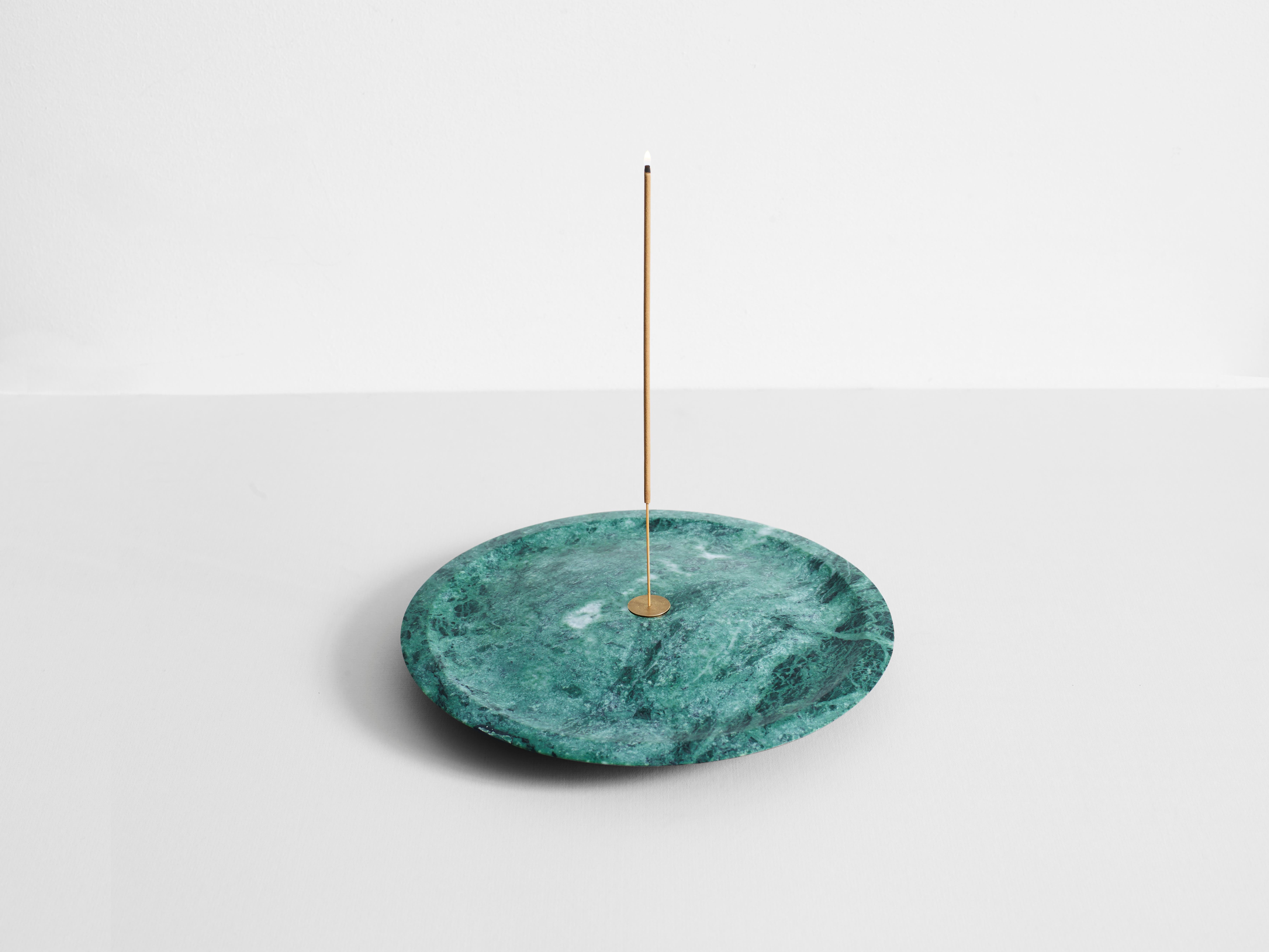 Green Guatemala Incense Plate by Henry Wilson
Dimensions: D 28 x H 4 cm
Materials: Green Guatemala Marble

The Incense plate is carved from solid Green Guatemala marble and uses a central brass insert to hold incense sticks. The insert is double