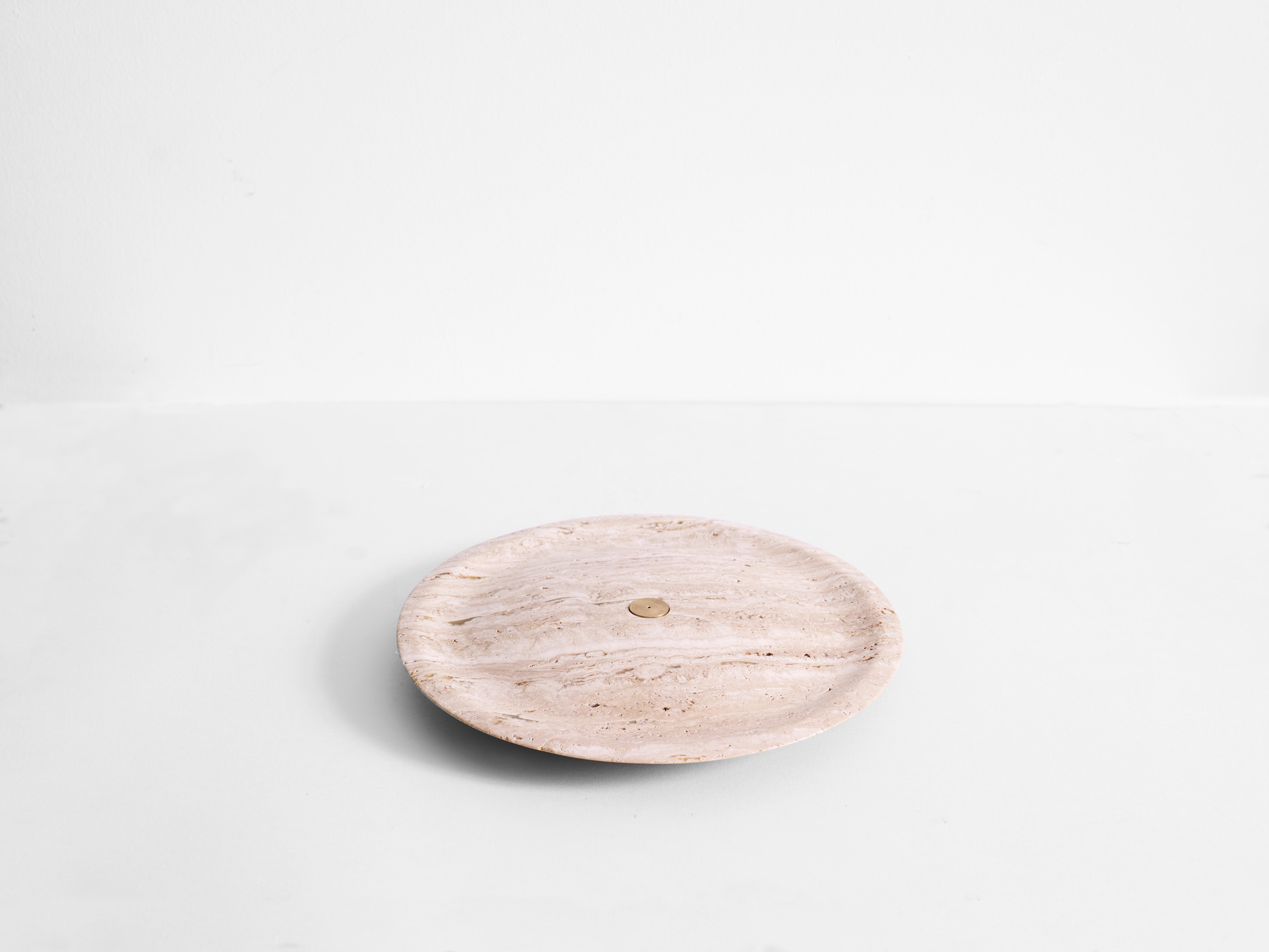 Incense plate, travertine sculpted marble by Henry Wilson

The incense plate is carved from solid green Guatemala marble and uses a central brass insert to hold incense sticks. The insert is double sided, one side for thin incense sticks, and one