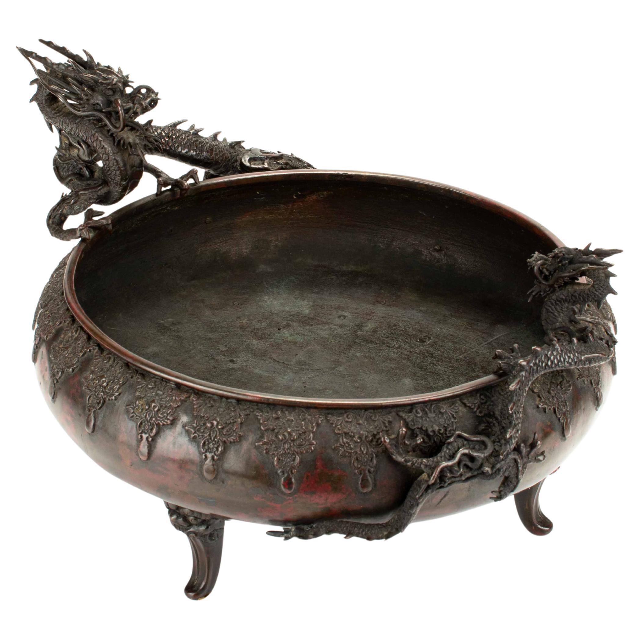 Bronze table incense burner with dark patina depicting two dragons
